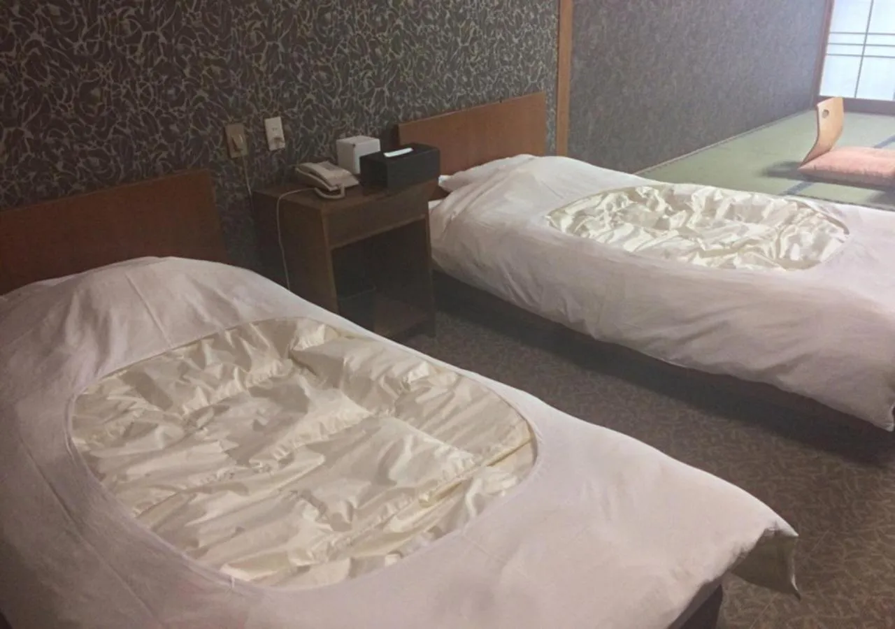 Bed in Higashiyama Park Hotel Shinfugetsu