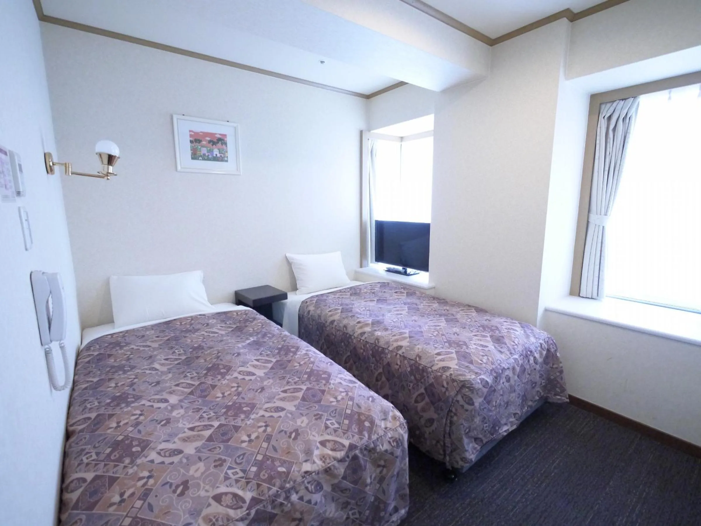 Photo of the whole room, Bed in U-Community Hotel