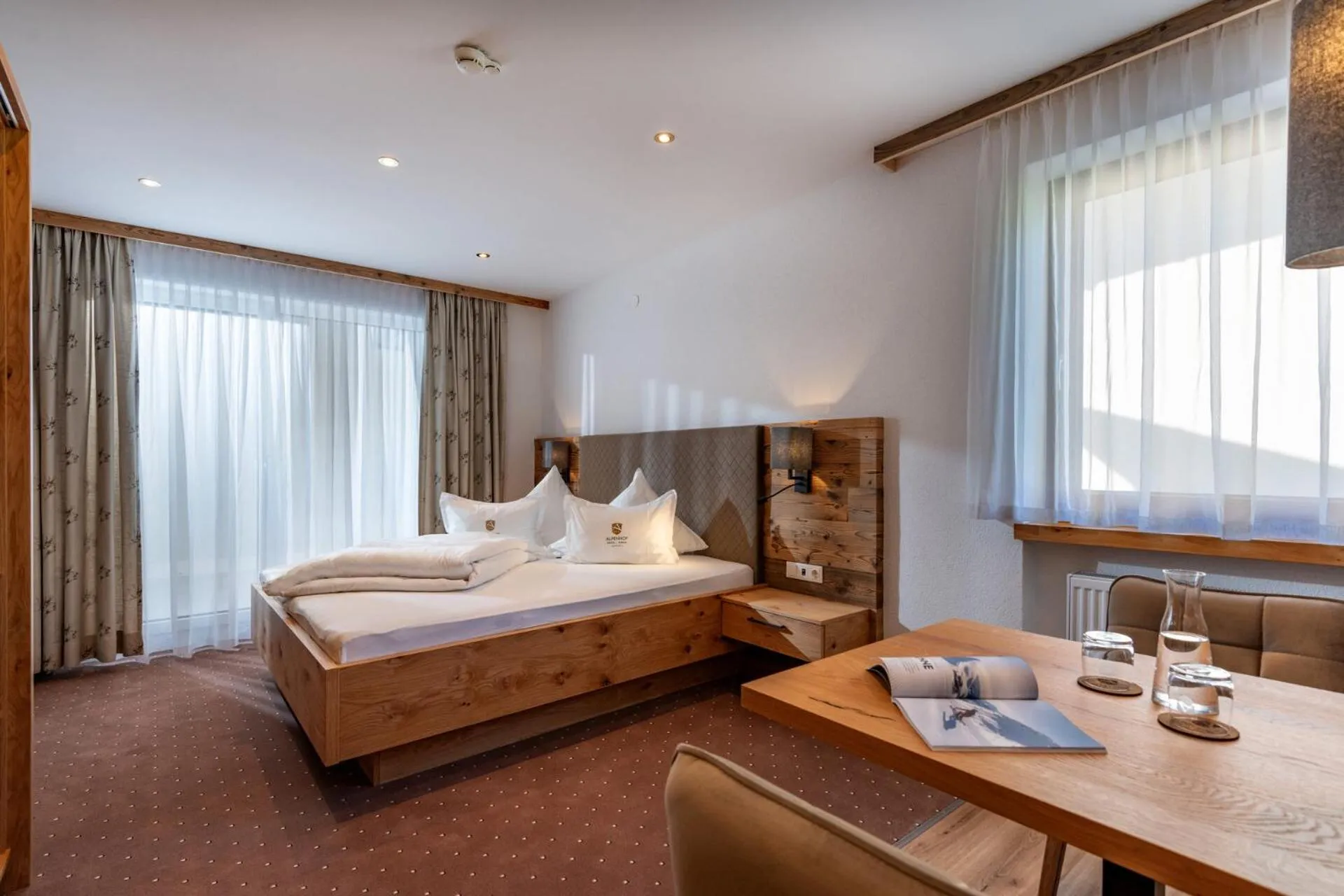 Bed in Alpenhof Hotel Garni Suprême