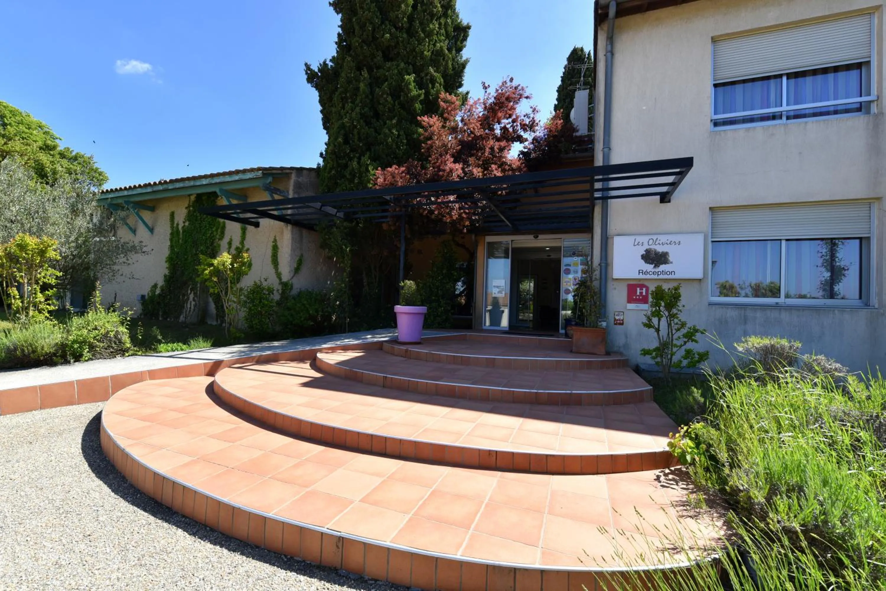 Property building in Logis Hotel Restaurant SPA Les Oliviers