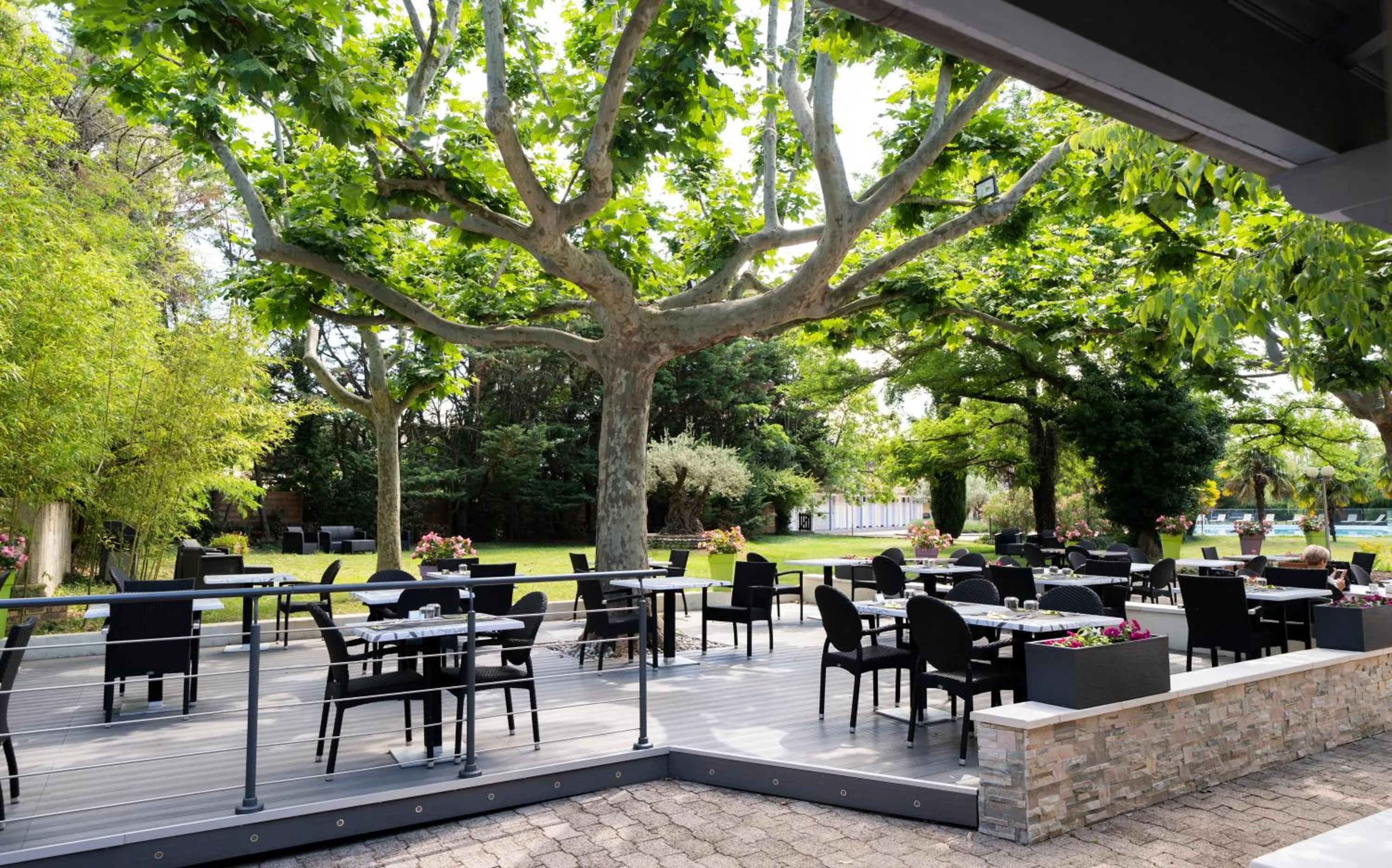 Patio in Logis Hotel Restaurant SPA Les Oliviers