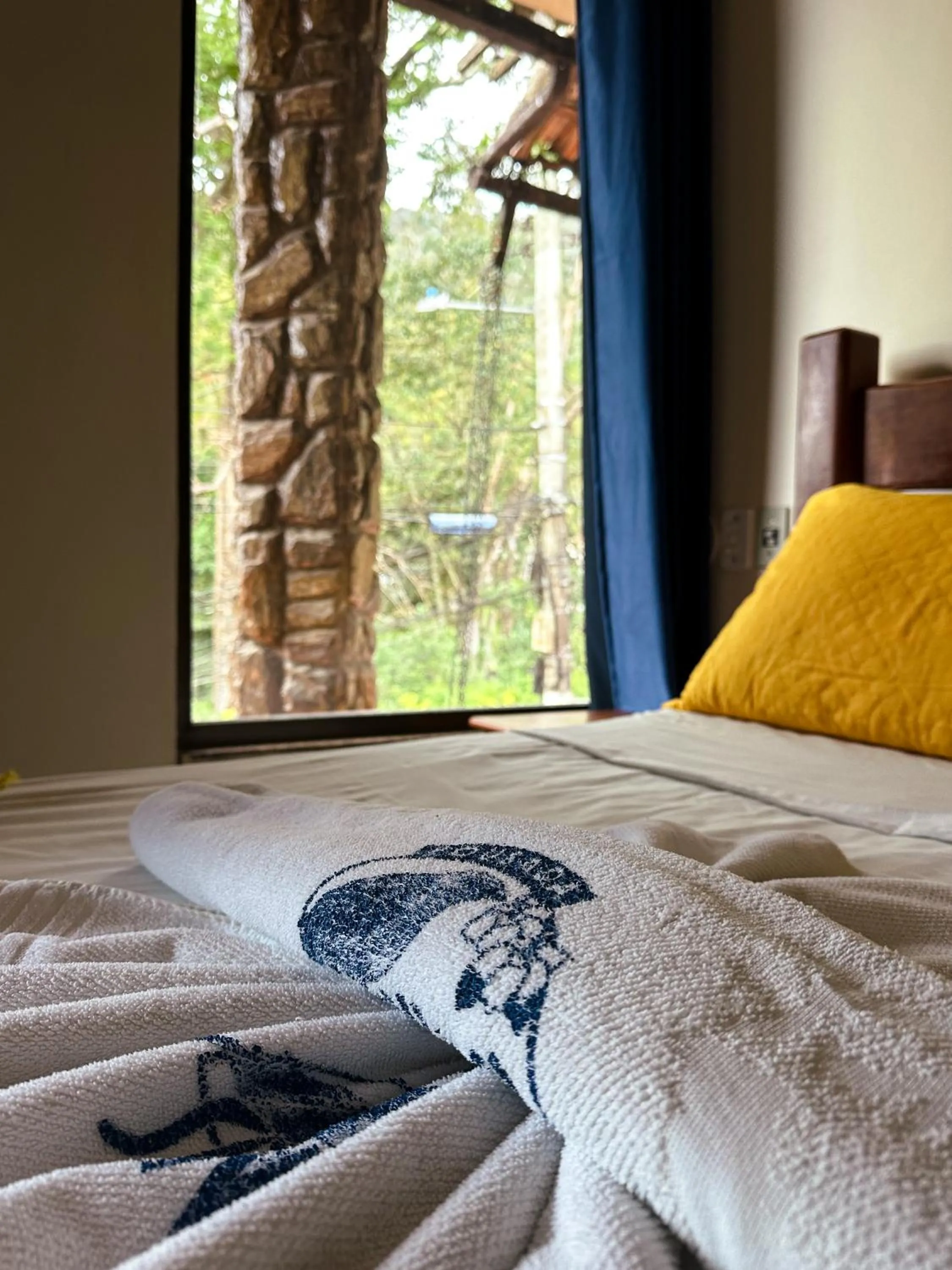 Bed in Pousada Sanhaço