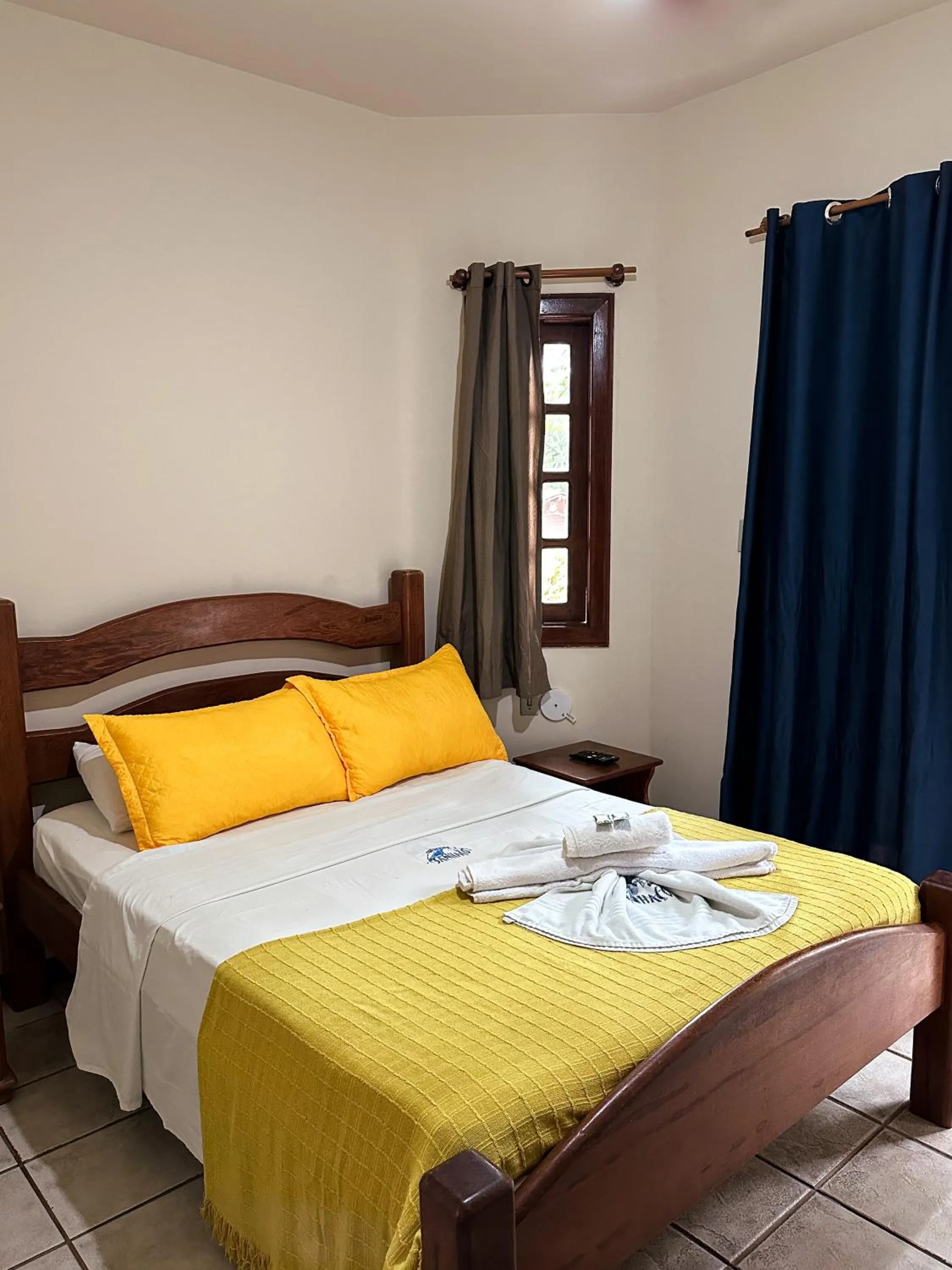 Bed in Pousada Sanhaço