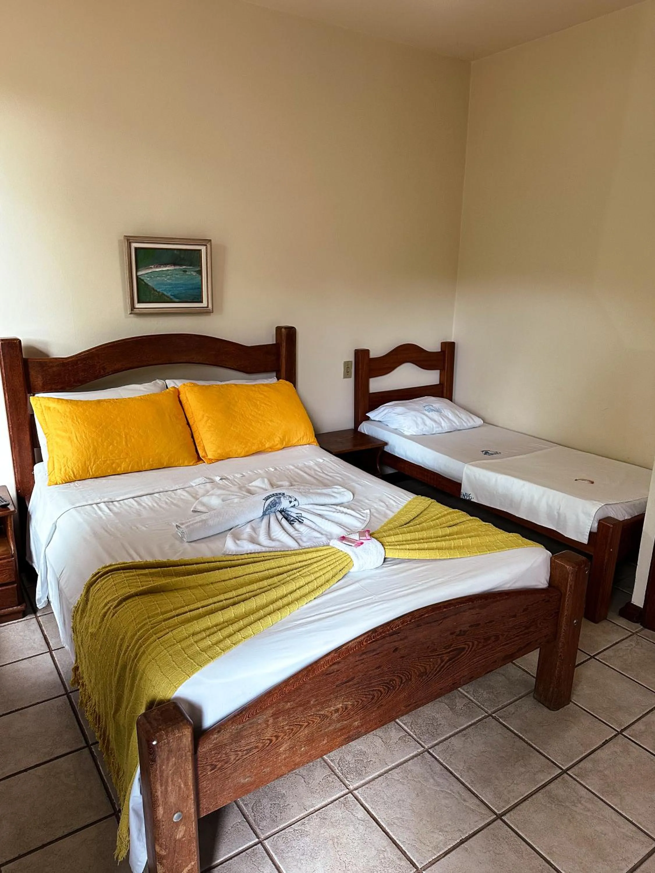 Bed in Pousada Sanhaço