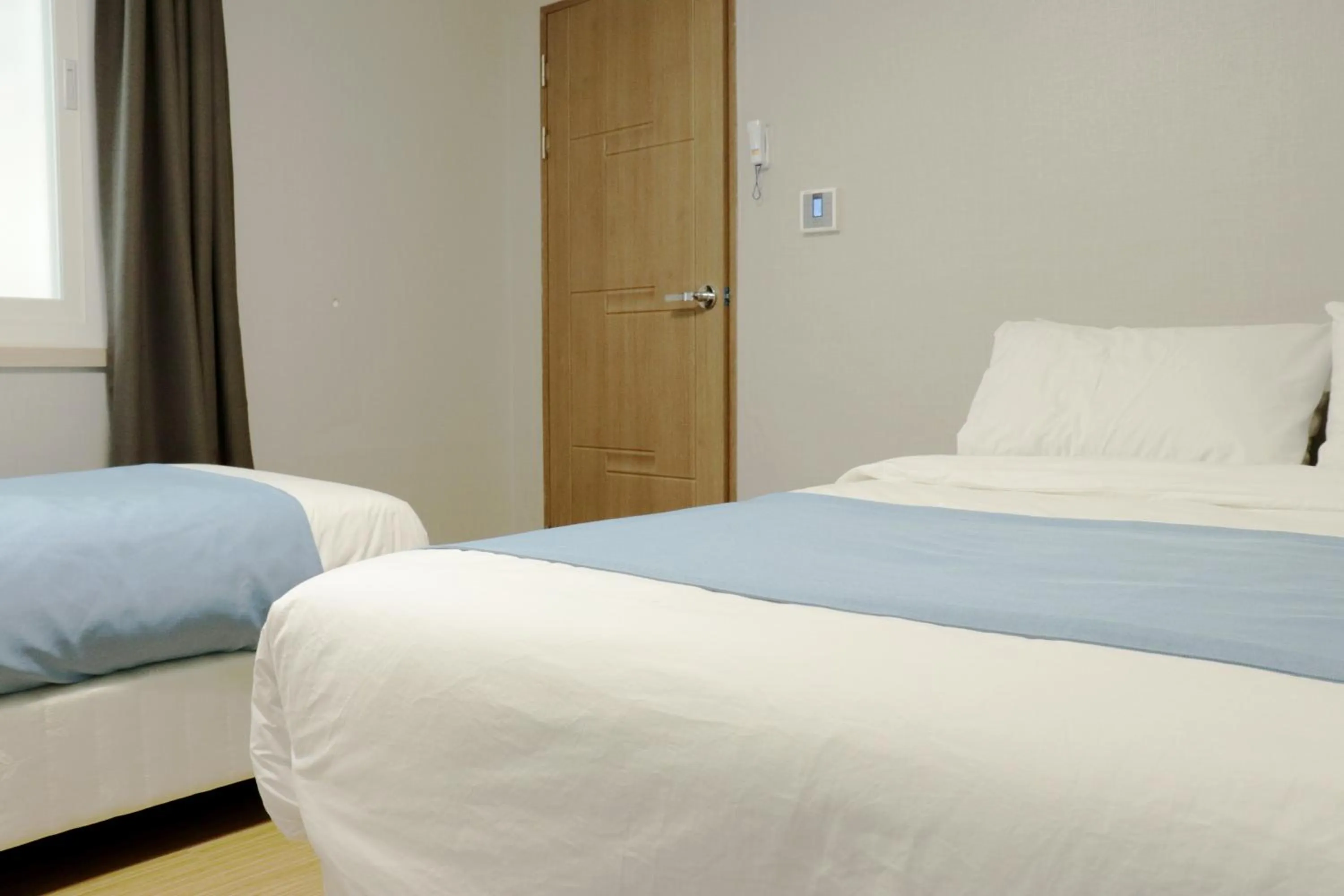 Bed in Ora Stay Hotel