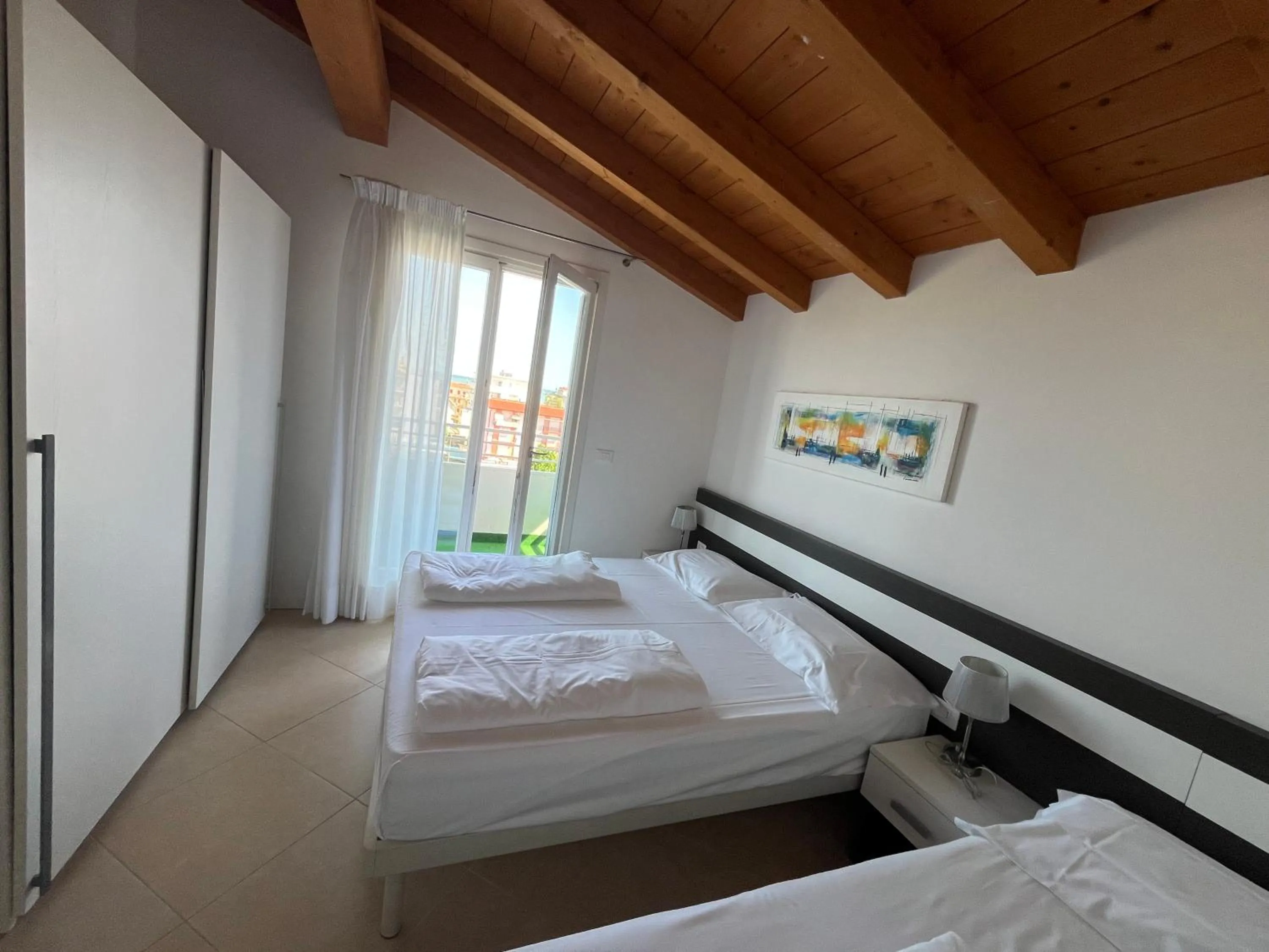 Bed in Villaggio Hemingway - Family Aparthotel