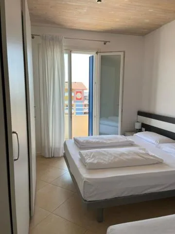 Bed in Villaggio Hemingway - Family Aparthotel