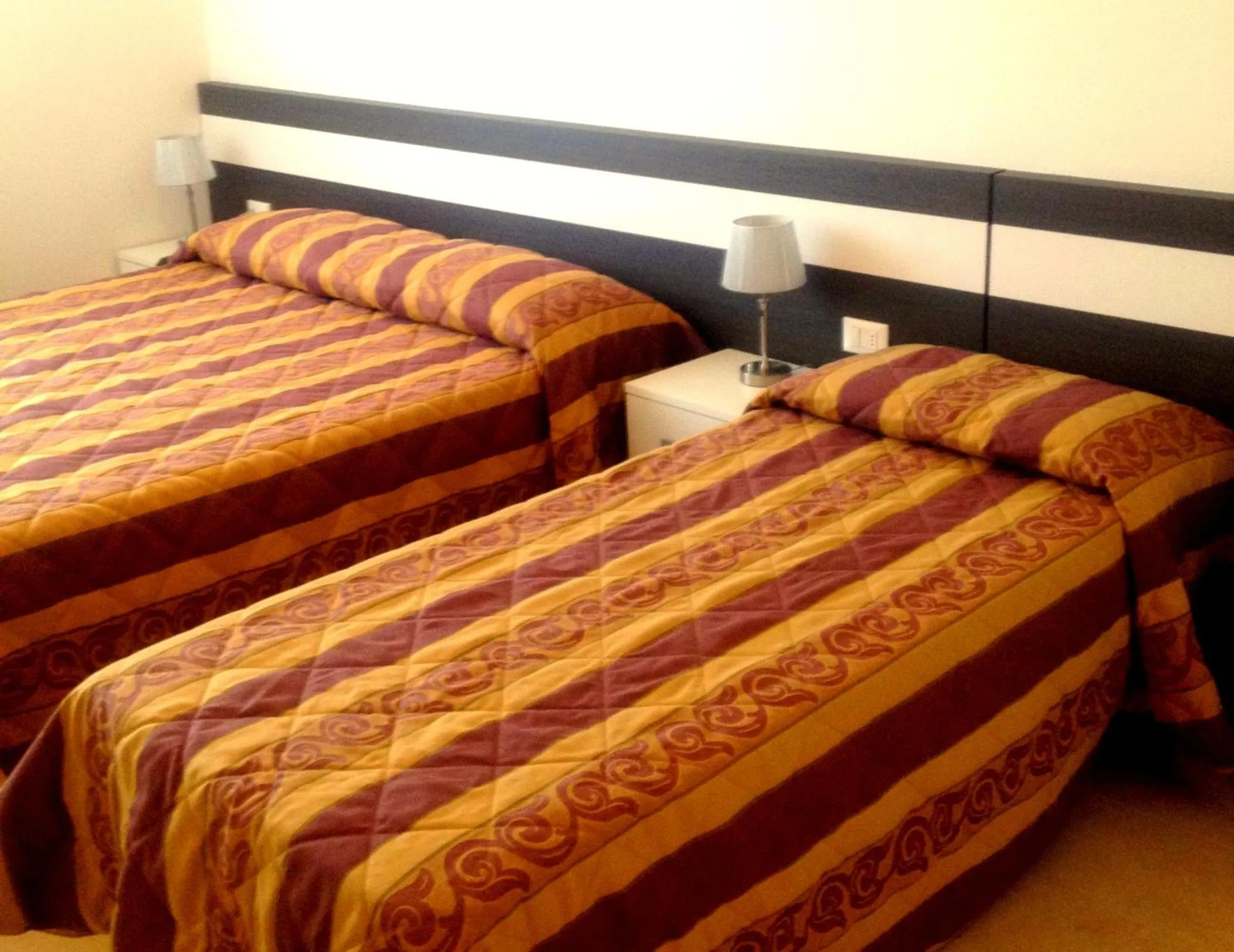 Bed in Villaggio Hemingway - Family Aparthotel