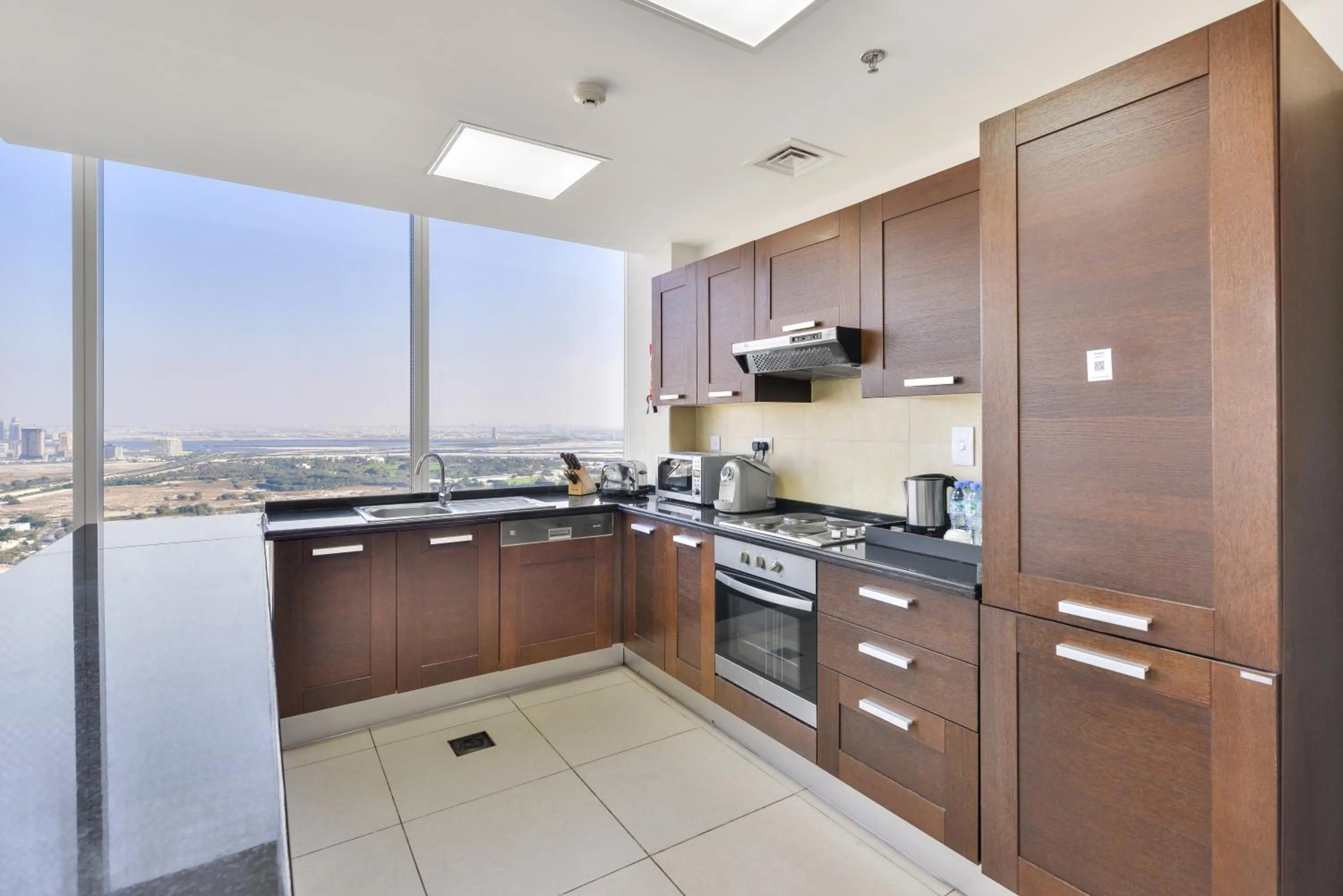 Kitchen or kitchenette in Nassima Tower Hotel Apartments