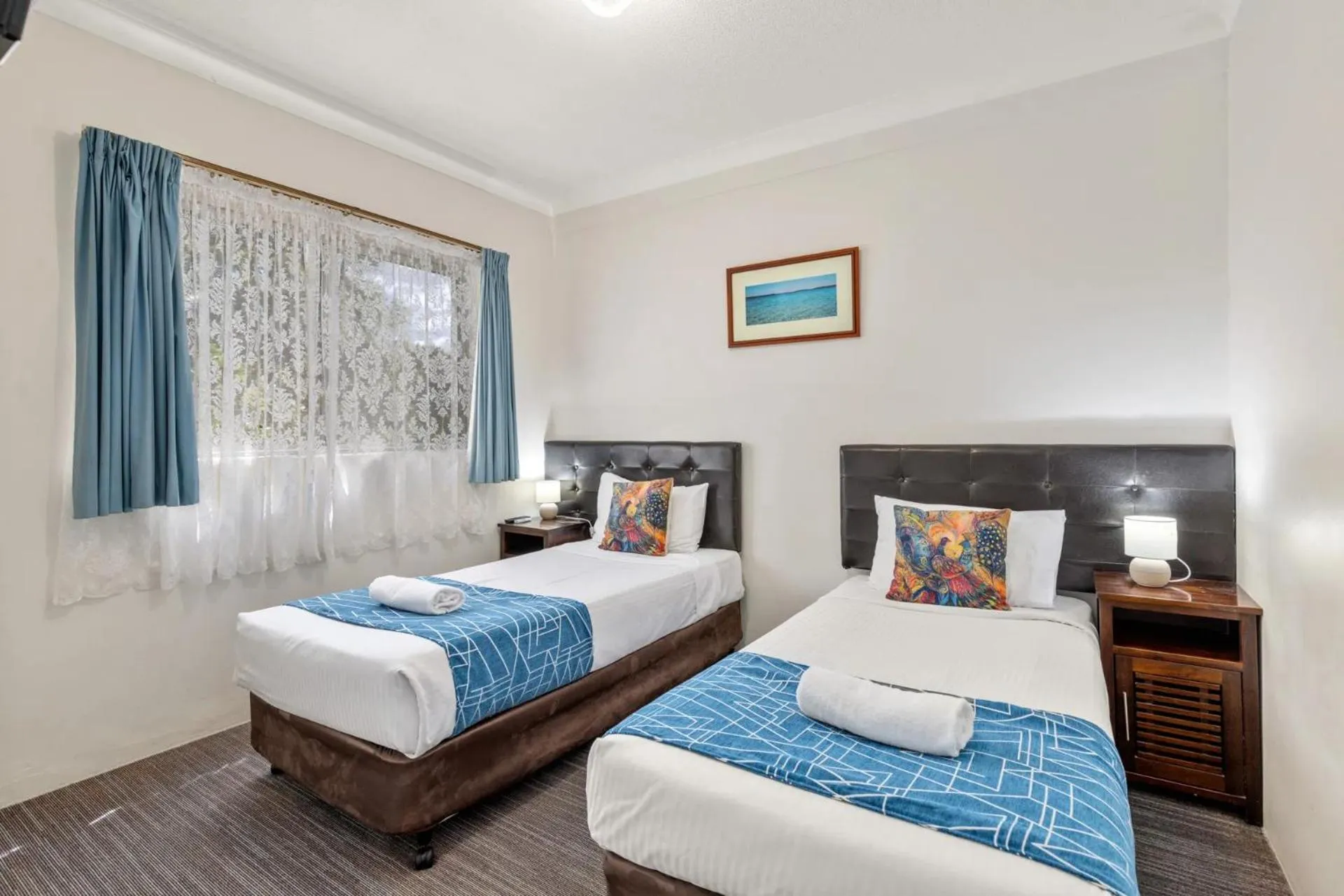 Bed in Sanctuary Resort Motor Inn