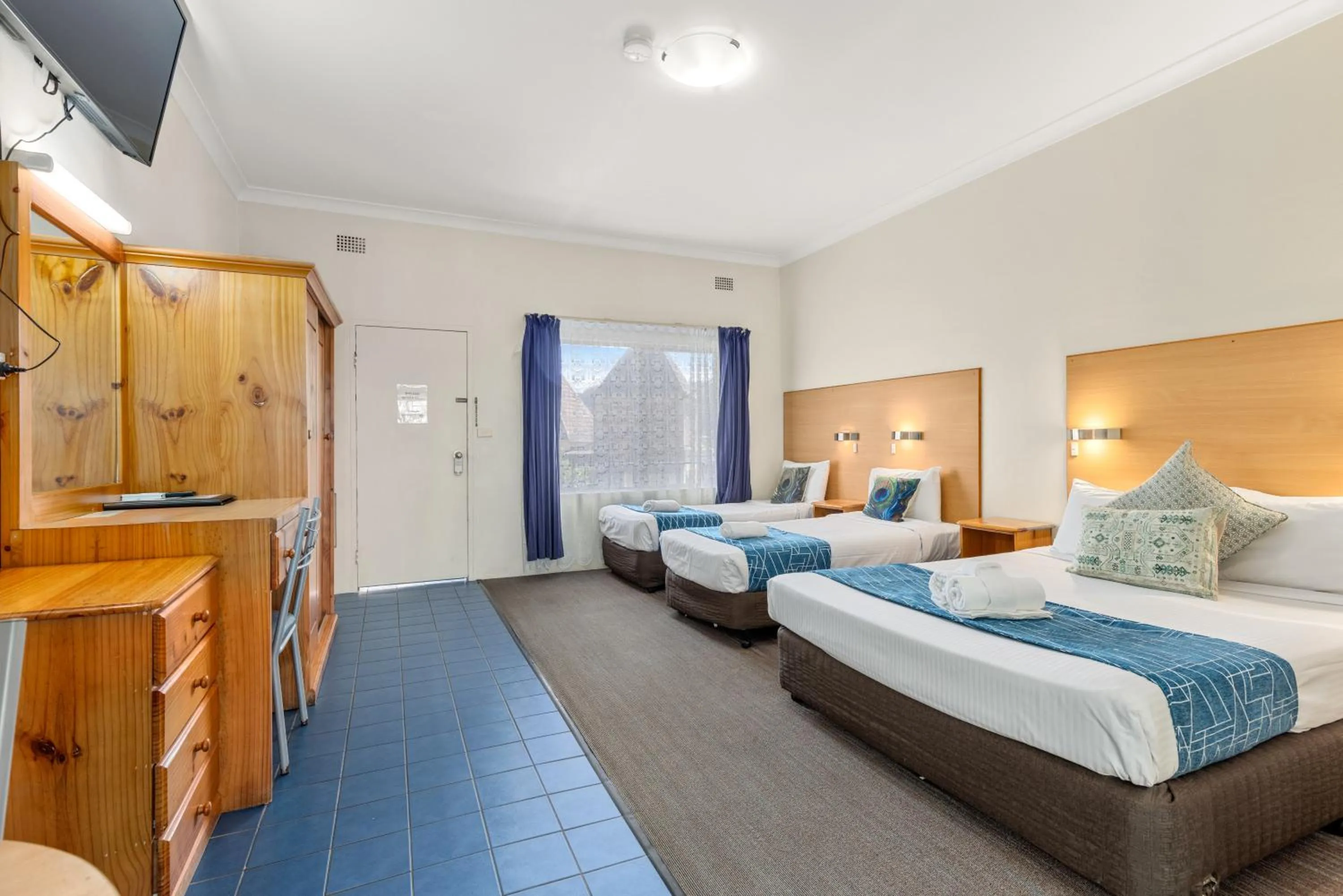 Bed in Sanctuary Resort Motor Inn