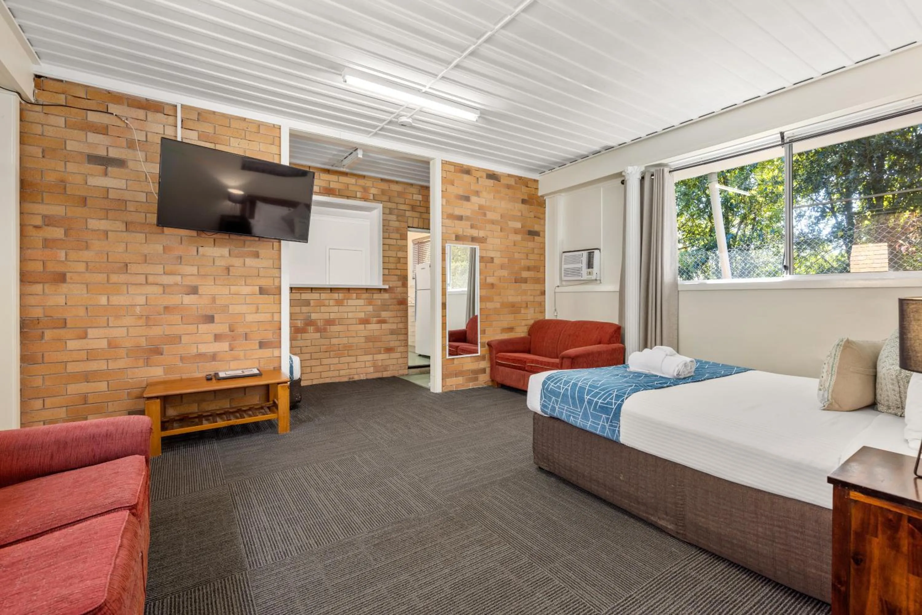 Bed in Sanctuary Resort Motor Inn