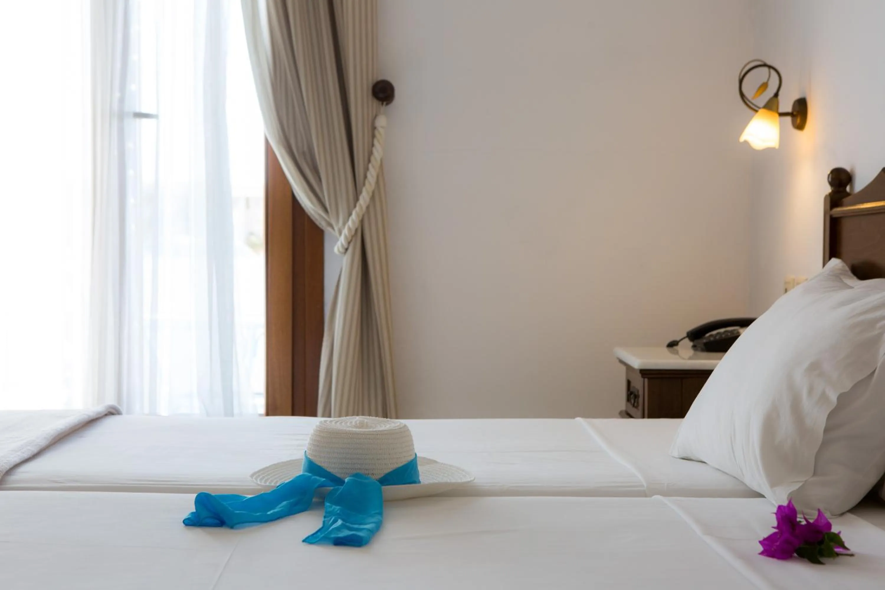 Bed in Plaza Beach Hotel