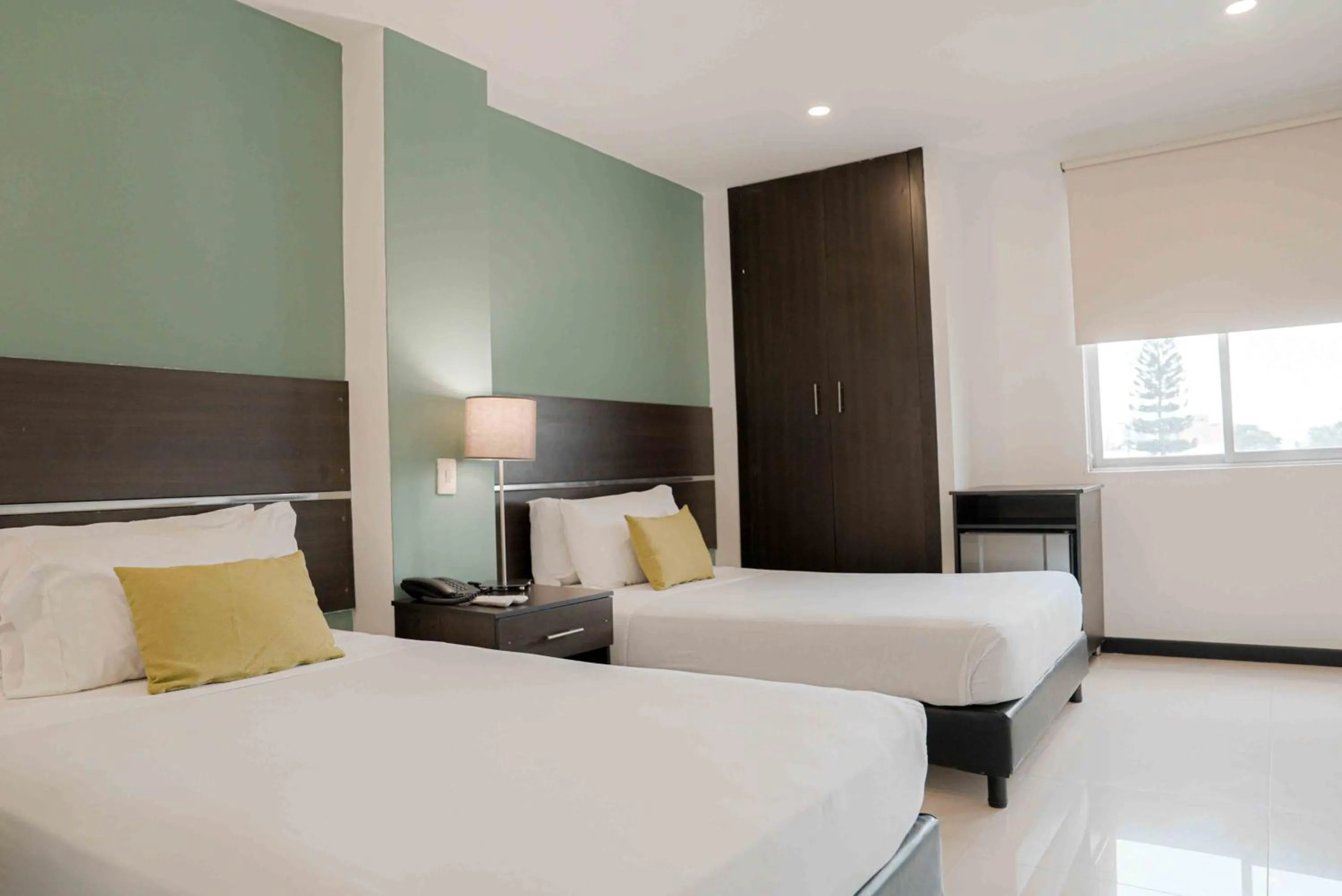 Bed in Basic Hotel Chipichape by Hoteles MS