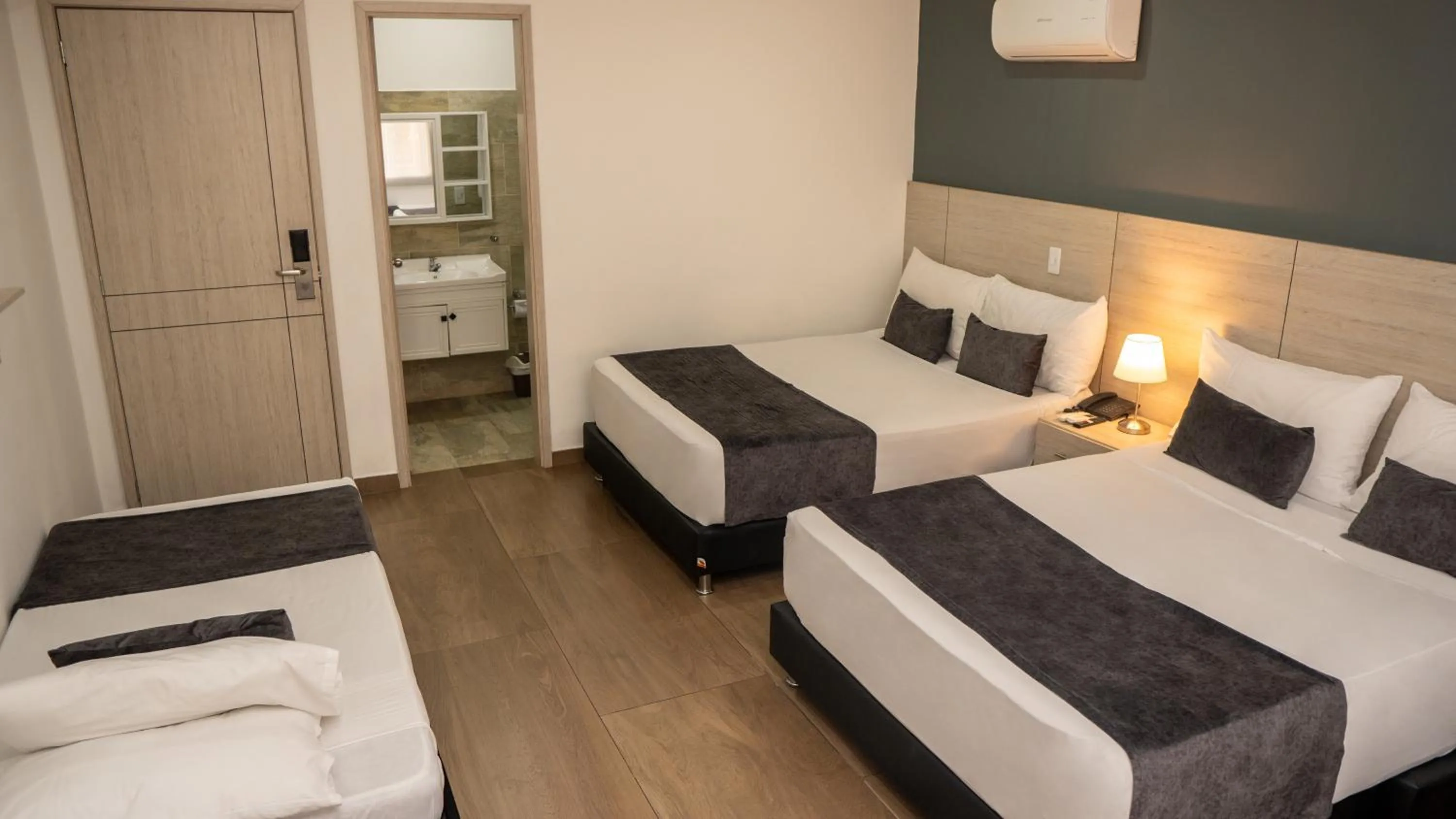 Bed in Basic Hotel Chipichape by Hoteles MS