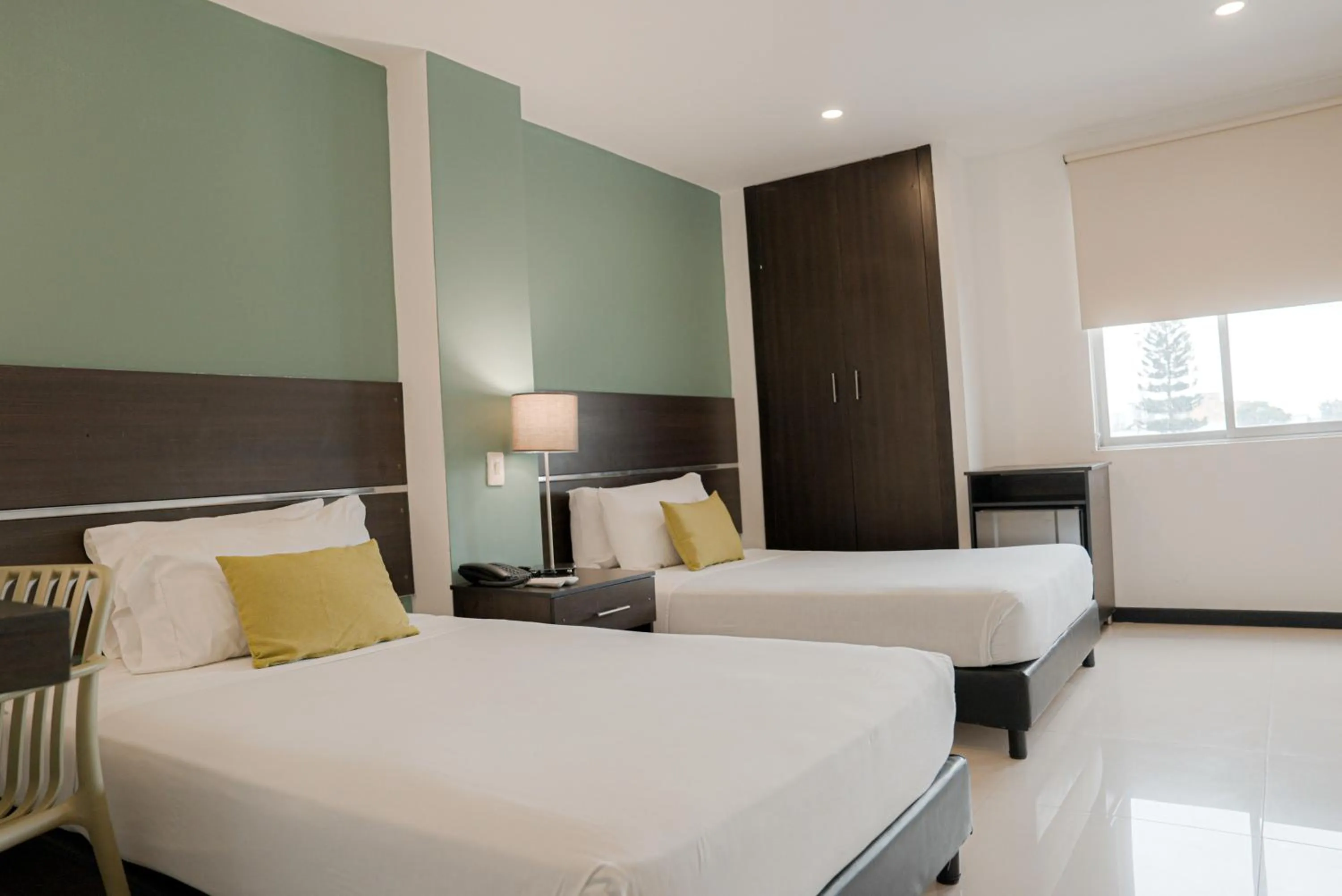 Bed in Basic Hotel Chipichape by Hoteles MS
