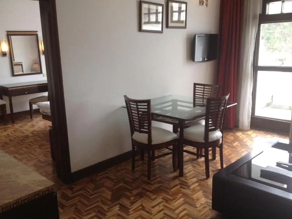 Dining area, Bed in Mastiff Grand Manali Resort