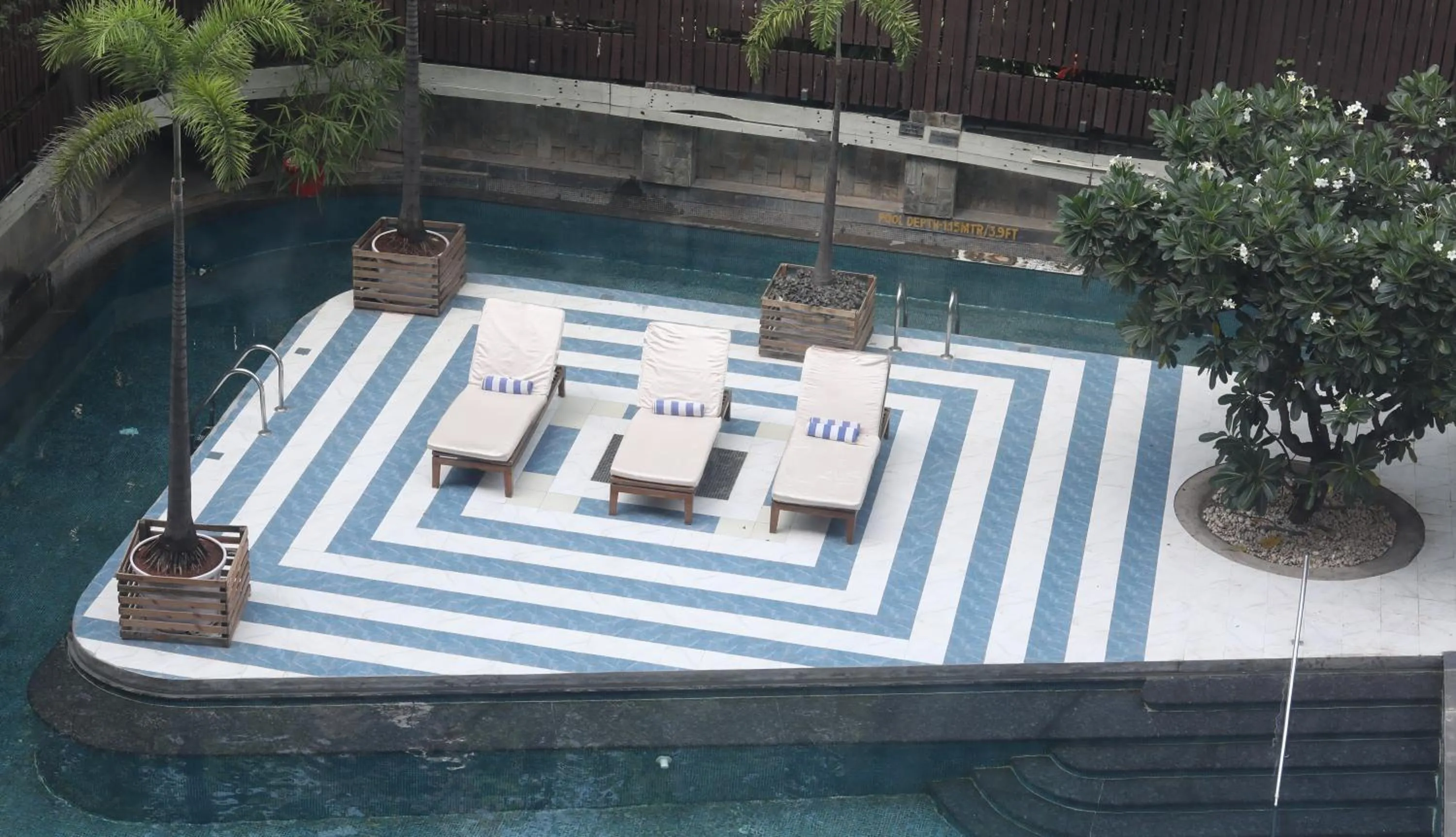 Swimming pool in Crowne Plaza Pune City Centre by IHG