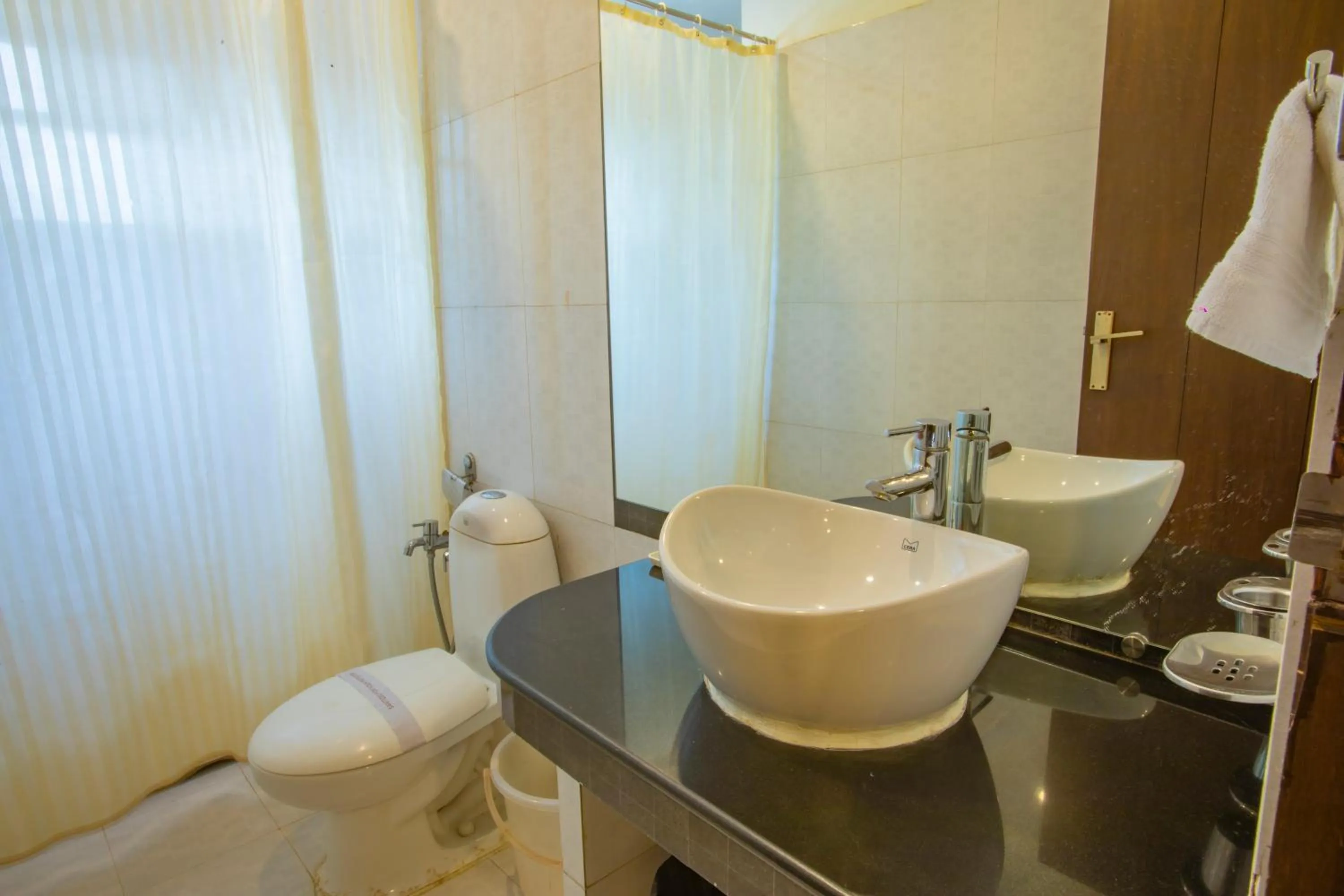 Bathroom in Nitya Resort, Calangute