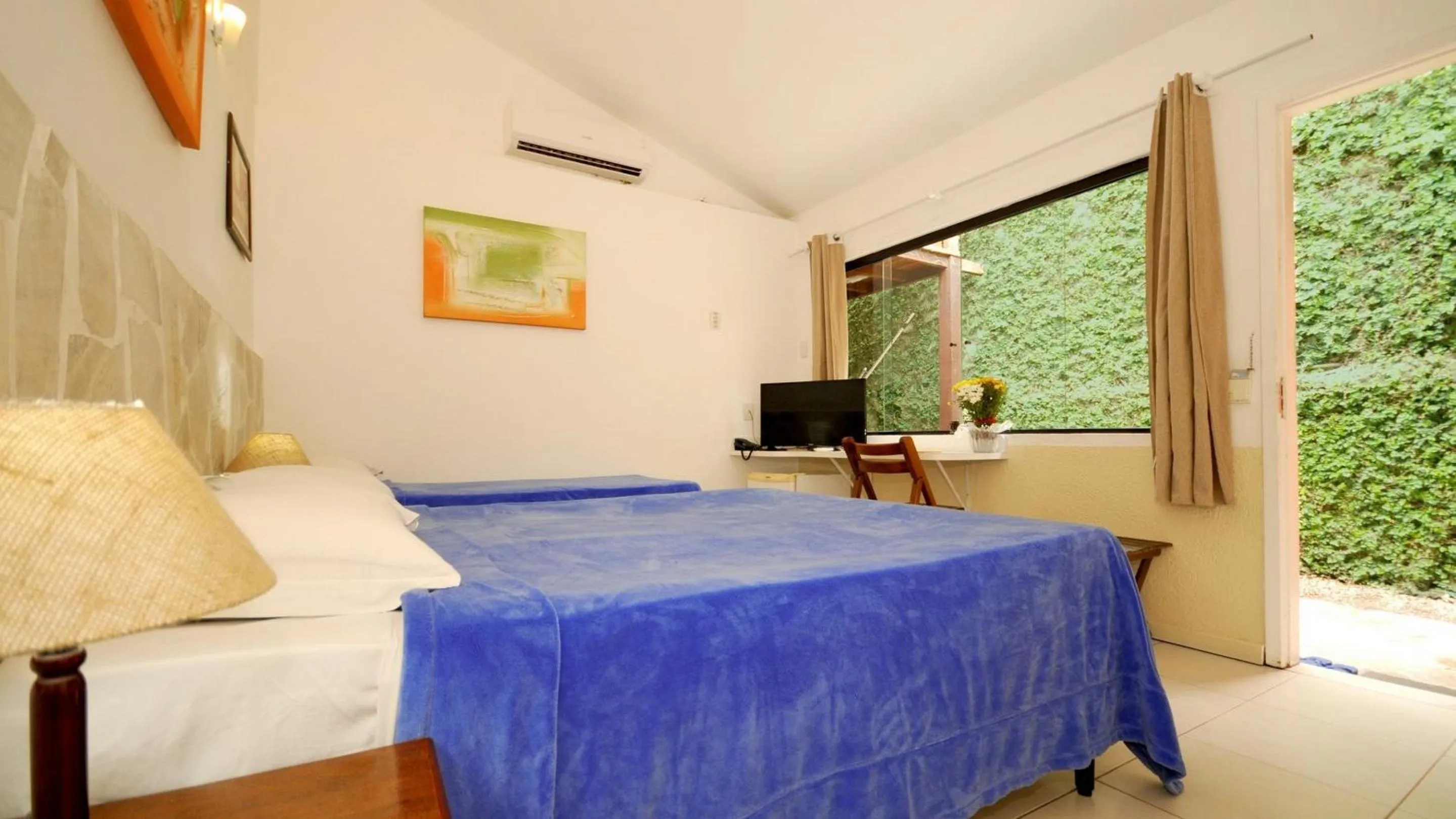 Bed in Pousada El Parador