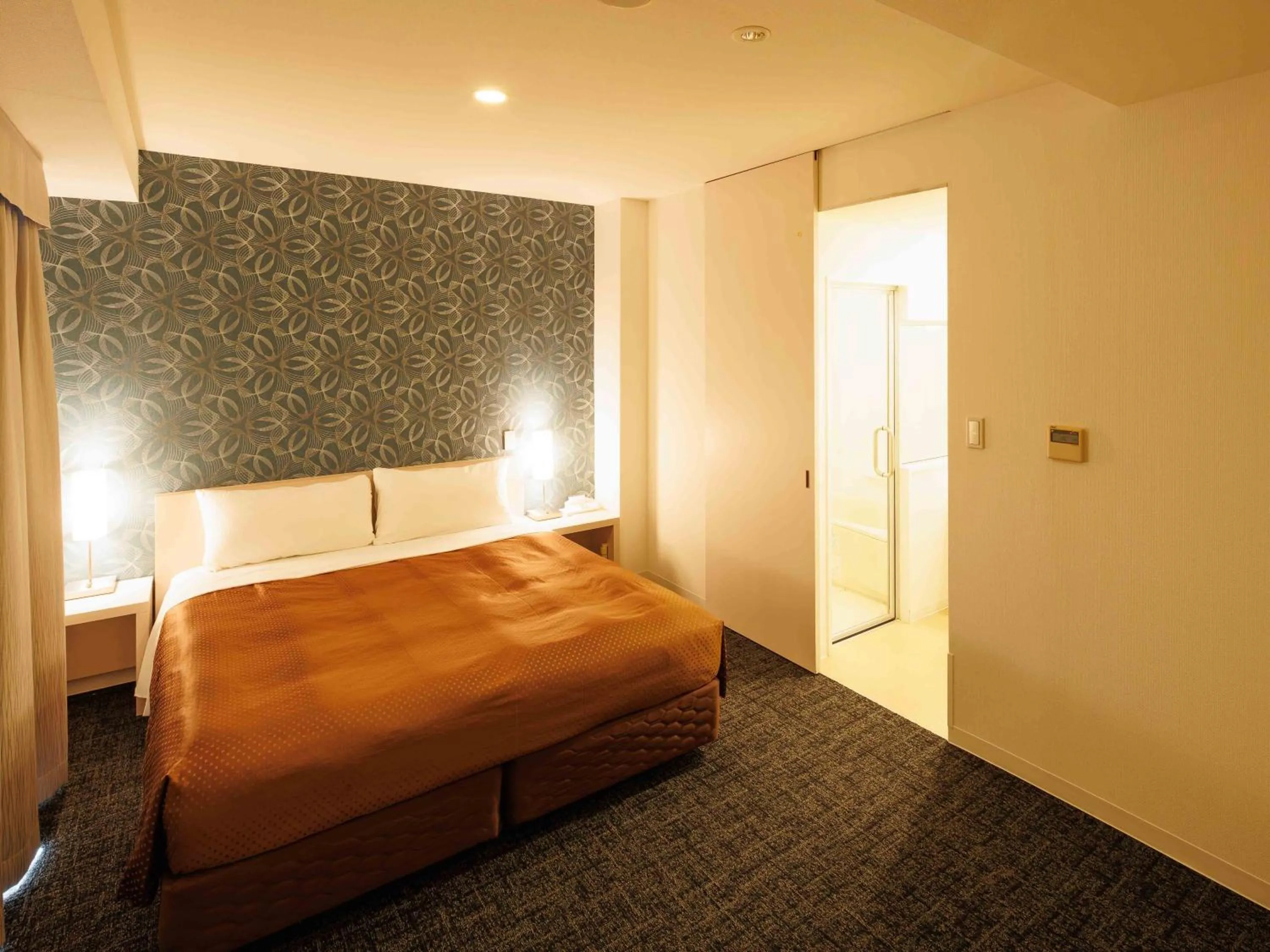 Bed in J Hotel Rinku