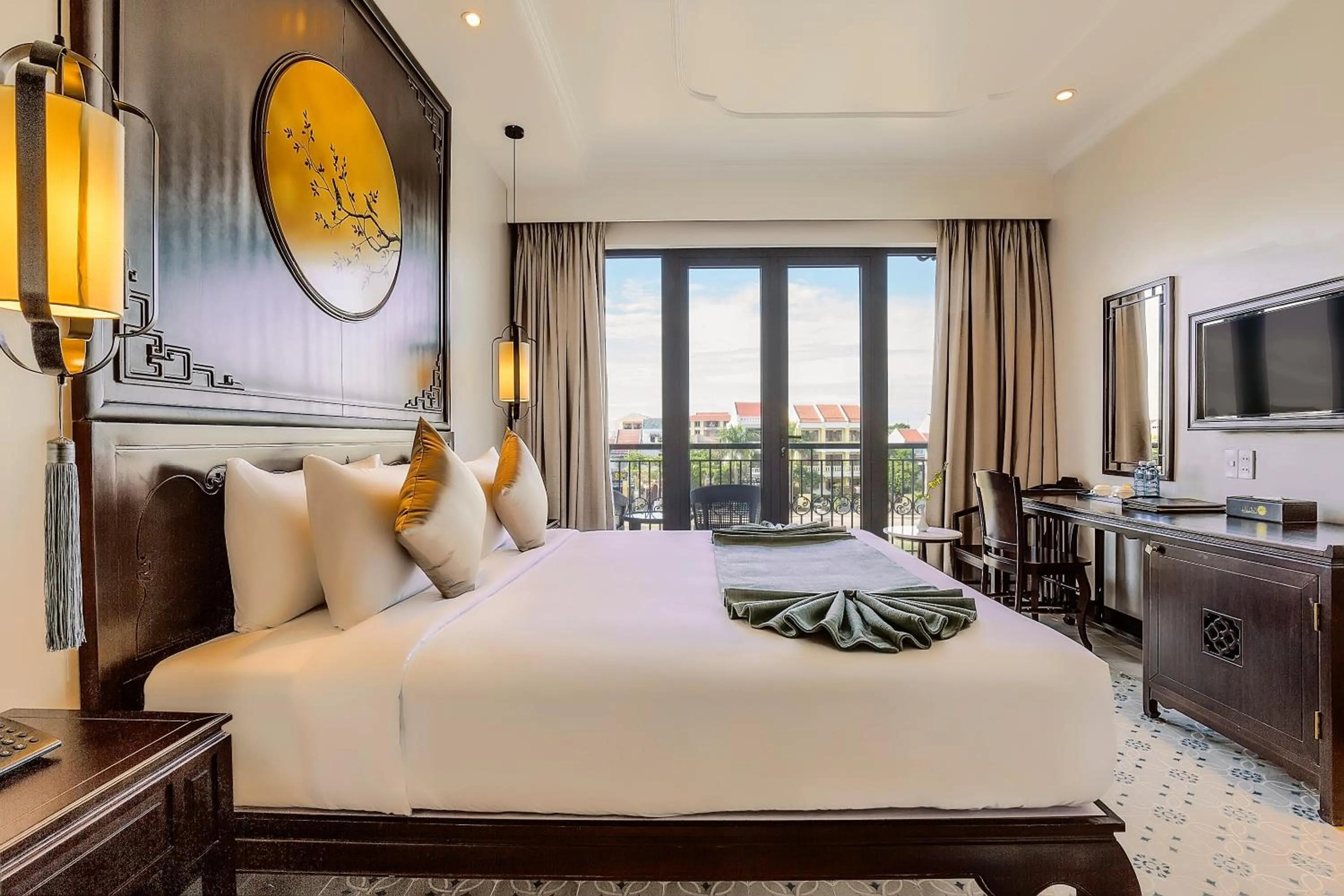 Communal lounge/ TV room, Bed in Laluna Hoi An Riverside Hotel & Spa