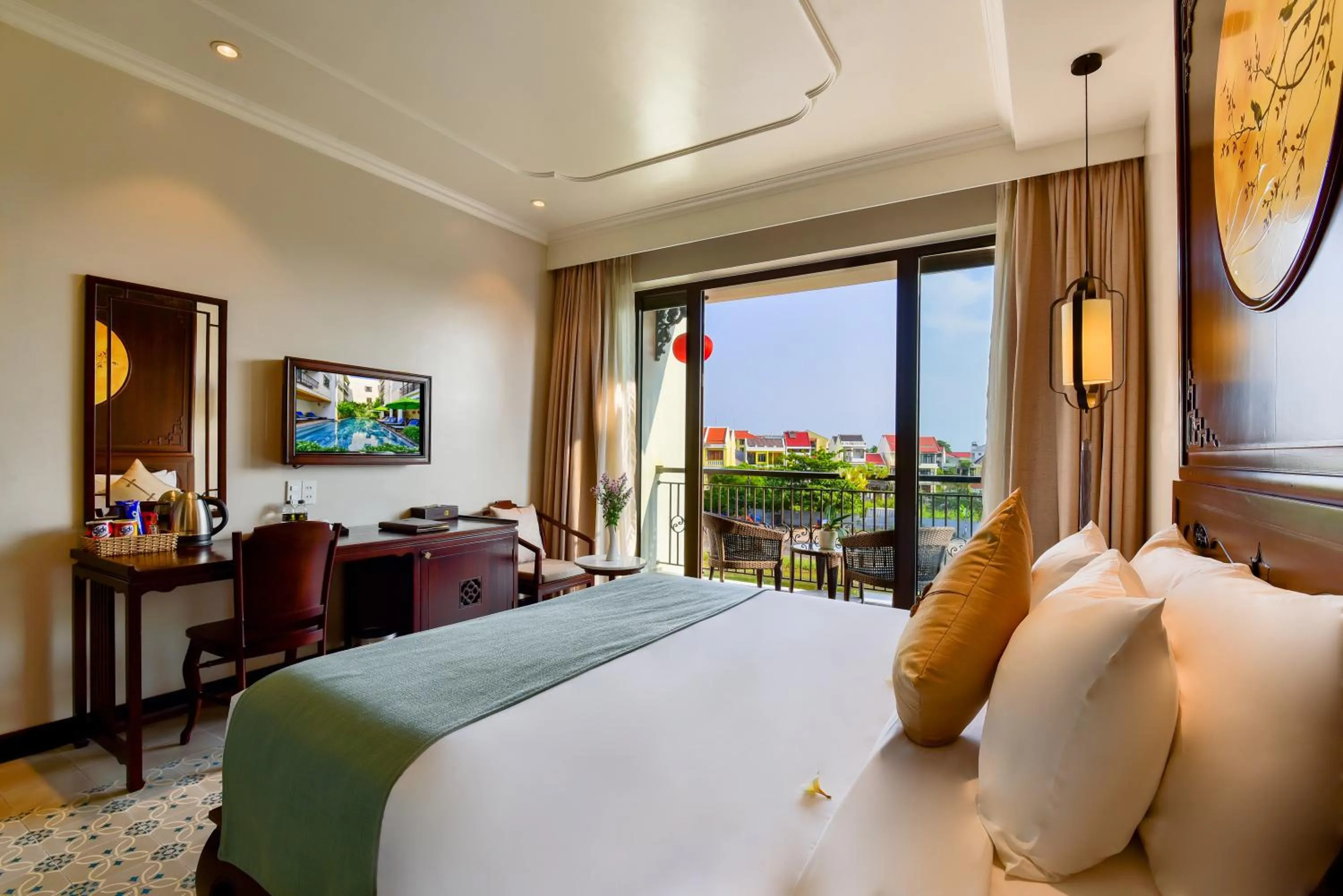 Communal lounge/ TV room, Bed in Laluna Hoi An Riverside Hotel & Spa