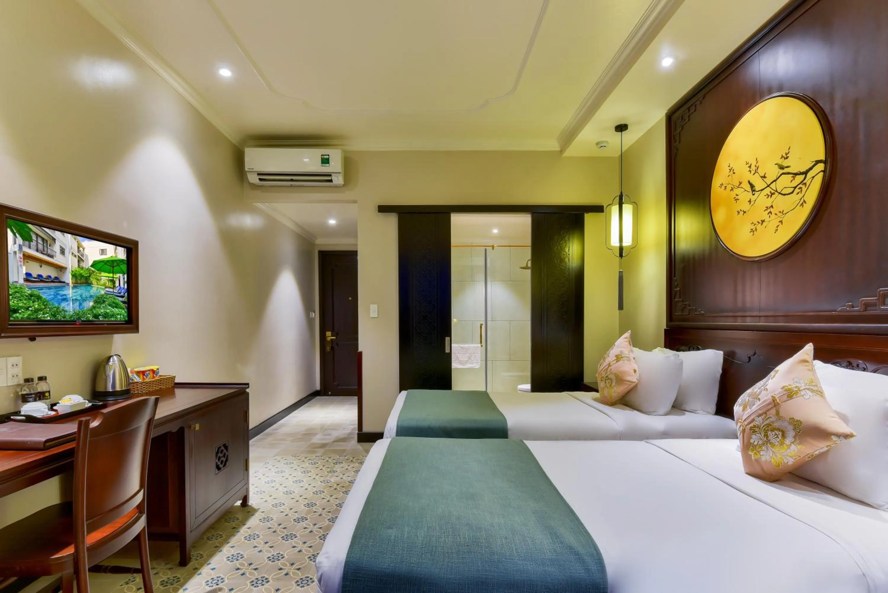 Communal lounge/ TV room, Bed in Laluna Hoi An Riverside Hotel & Spa