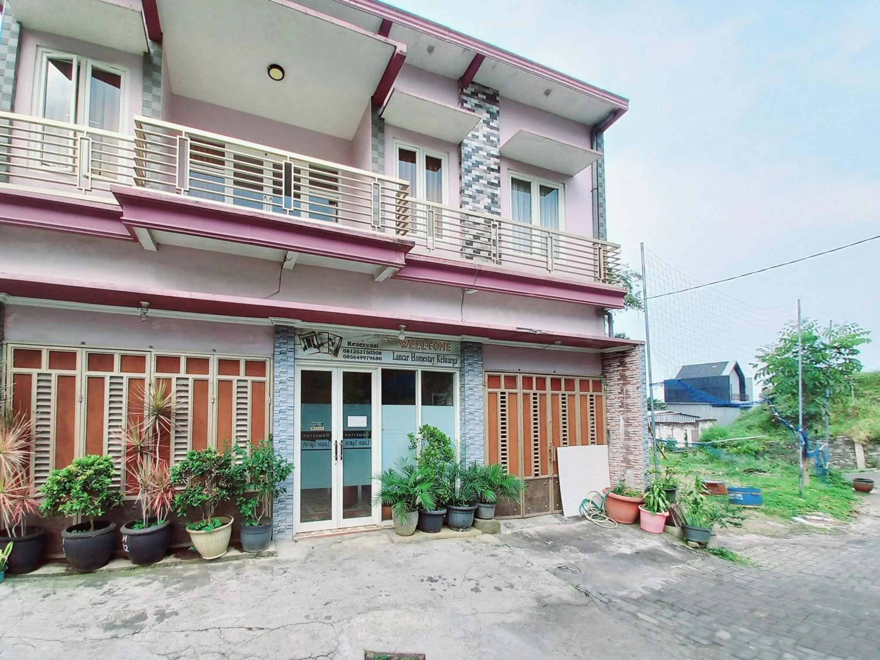 Facade/entrance in Lancar Homestay Syariah near BNS Mitra RedDoorz
