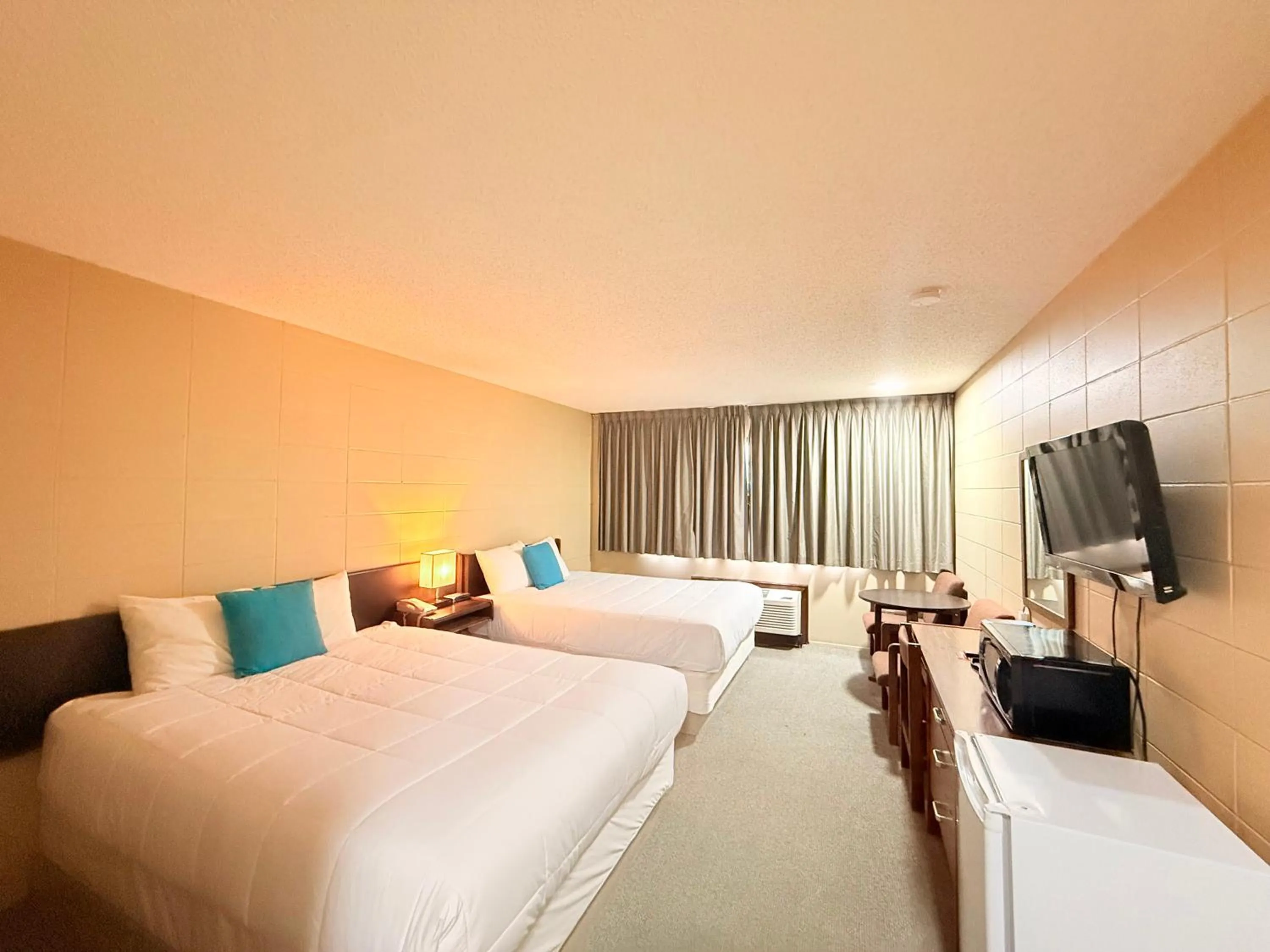 Bed in Capri Motor Inn