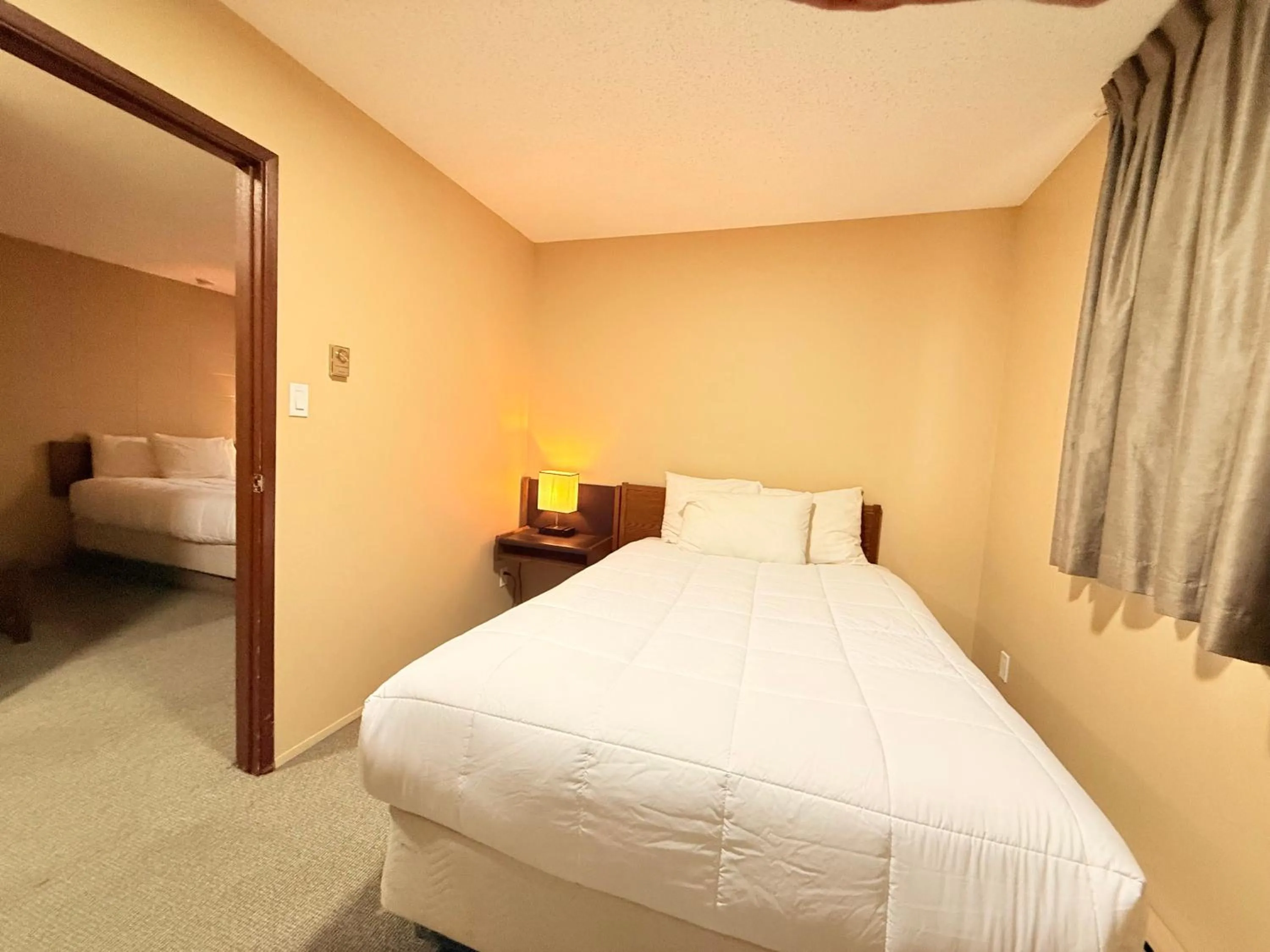 Bed in Capri Motor Inn