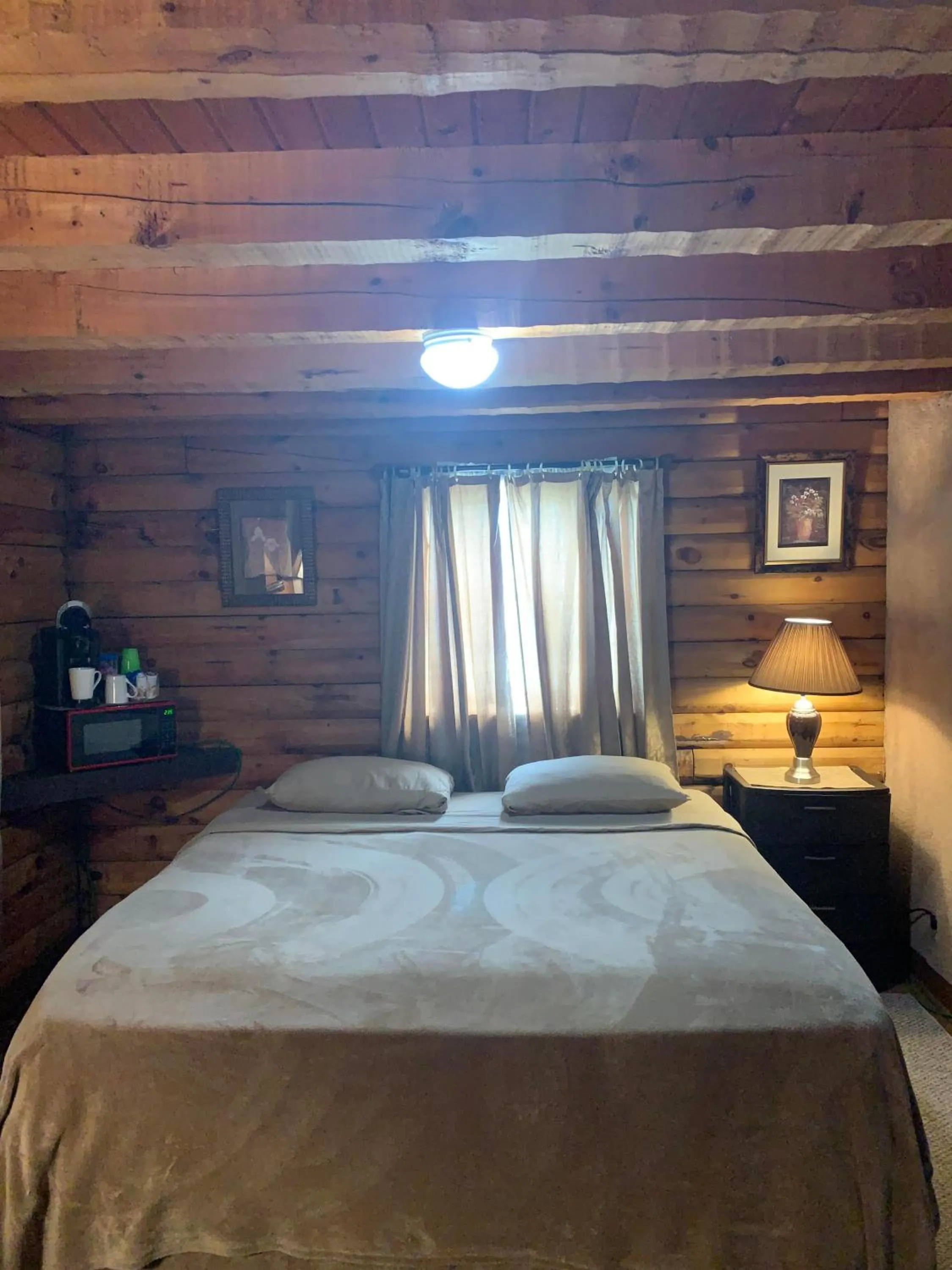 Bed in Log Cabin in the Field