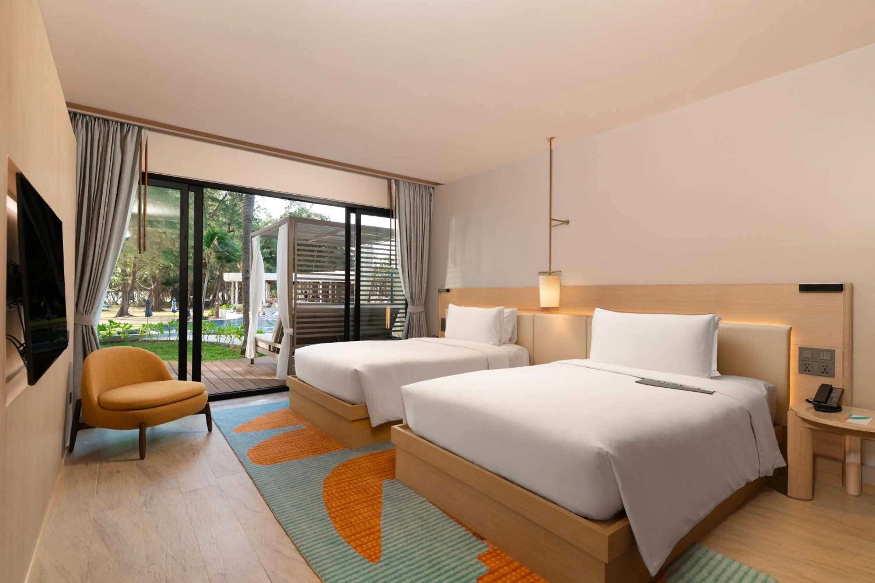 Bed in Le Meridien Phuket Mai Khao Beach Resort