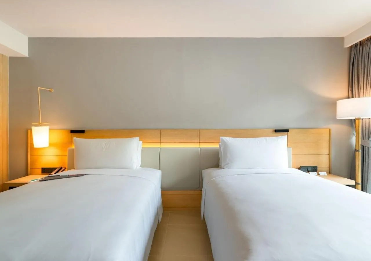 Bed in Le Meridien Phuket Mai Khao Beach Resort