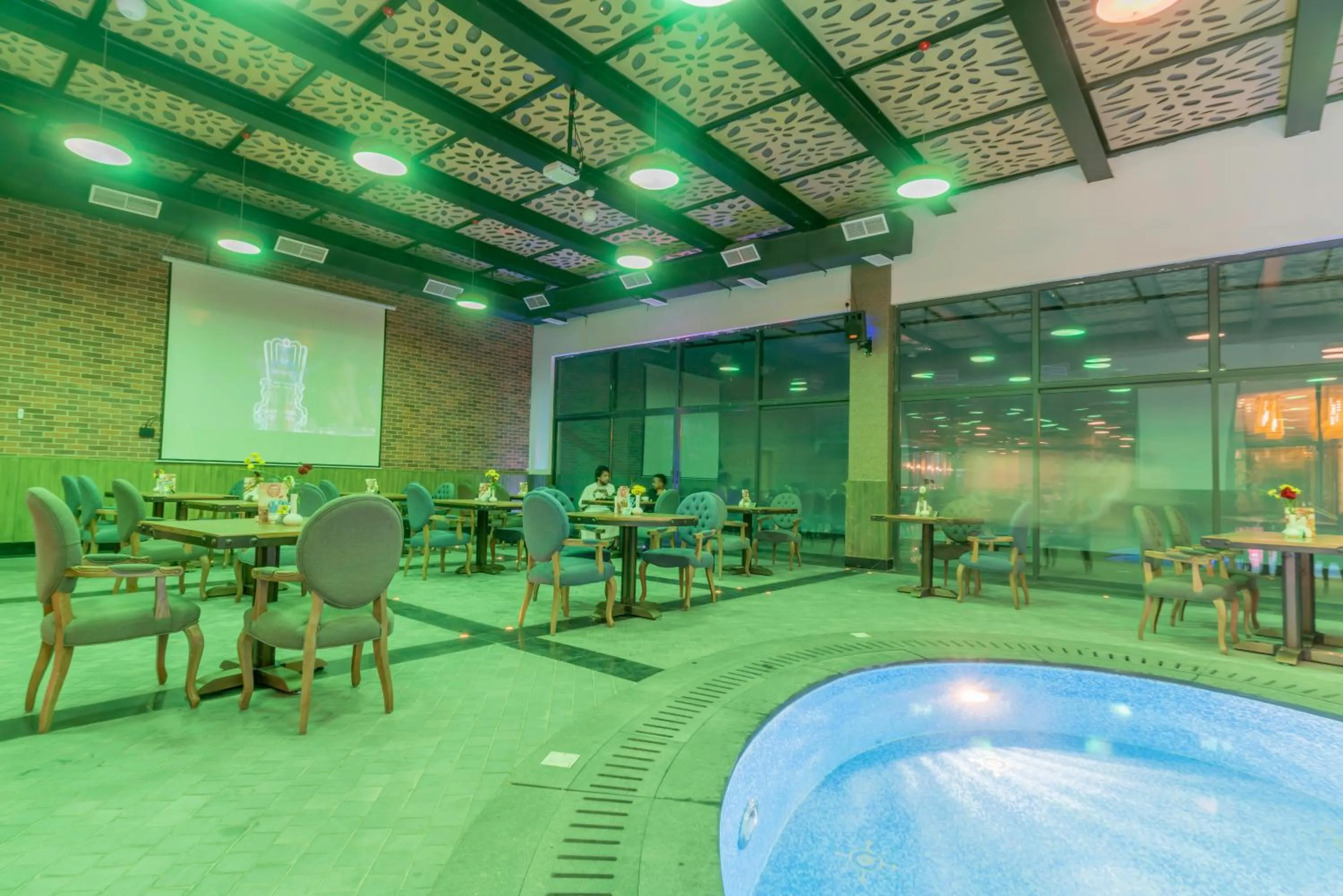 Communal lounge/ TV room in Makeen Homes by Warwick Hotel