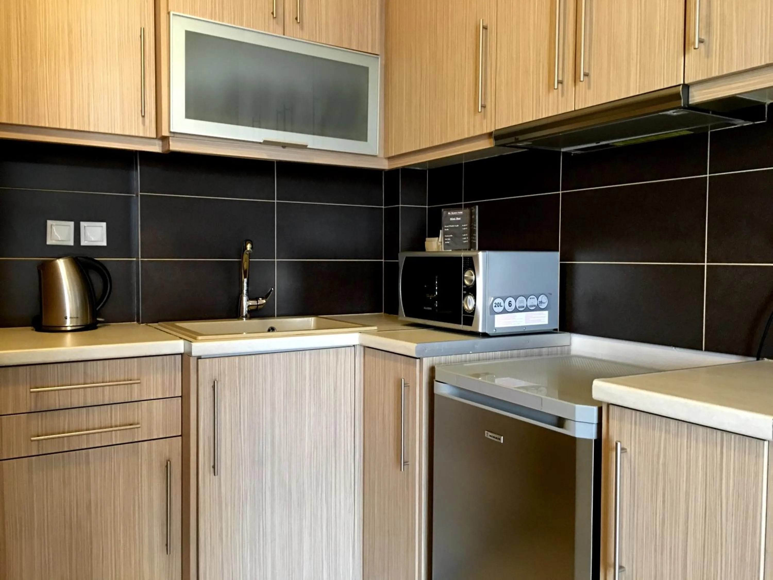 Kitchen or kitchenette in Mc Queen Rooms & Apartments