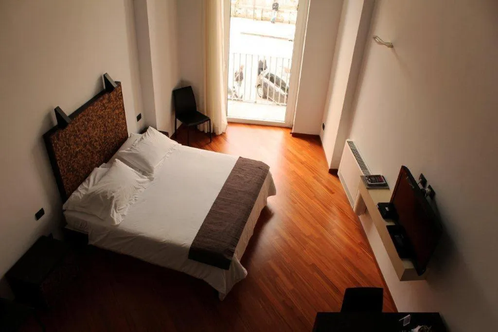 Bed in Alvino Suite And Breakfast