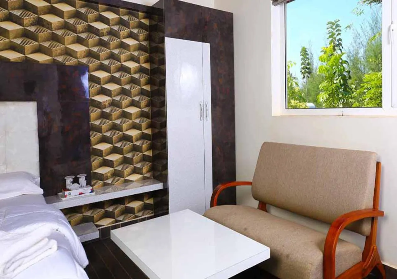 Seating area, Bed in SR Jungle Resort