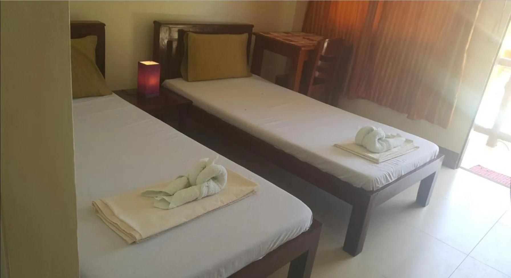 Bed in SLAM'S Garden Dive Resort