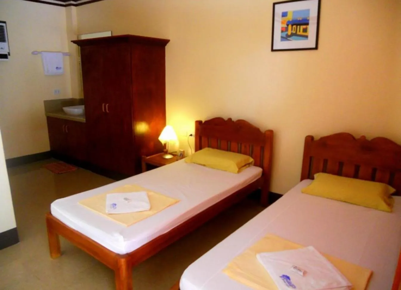 Bed in SLAM'S Garden Dive Resort