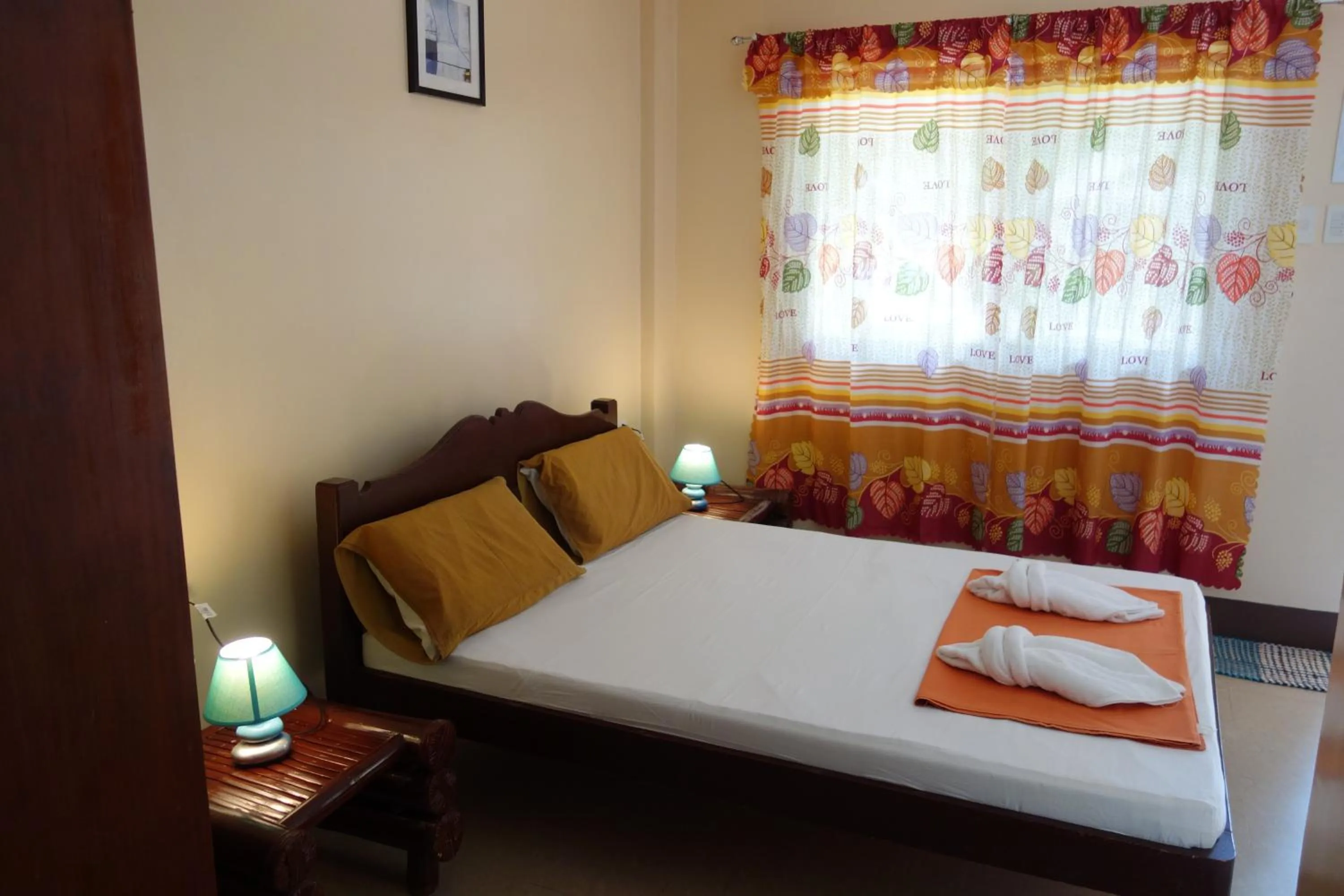 Bed in SLAM'S Garden Dive Resort