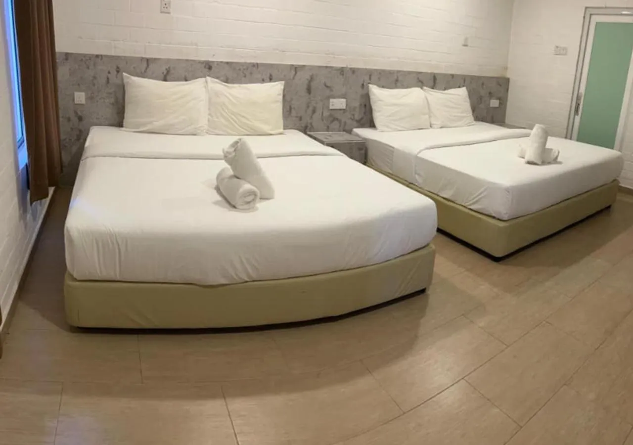 Bed in D'Lima Beach Inn