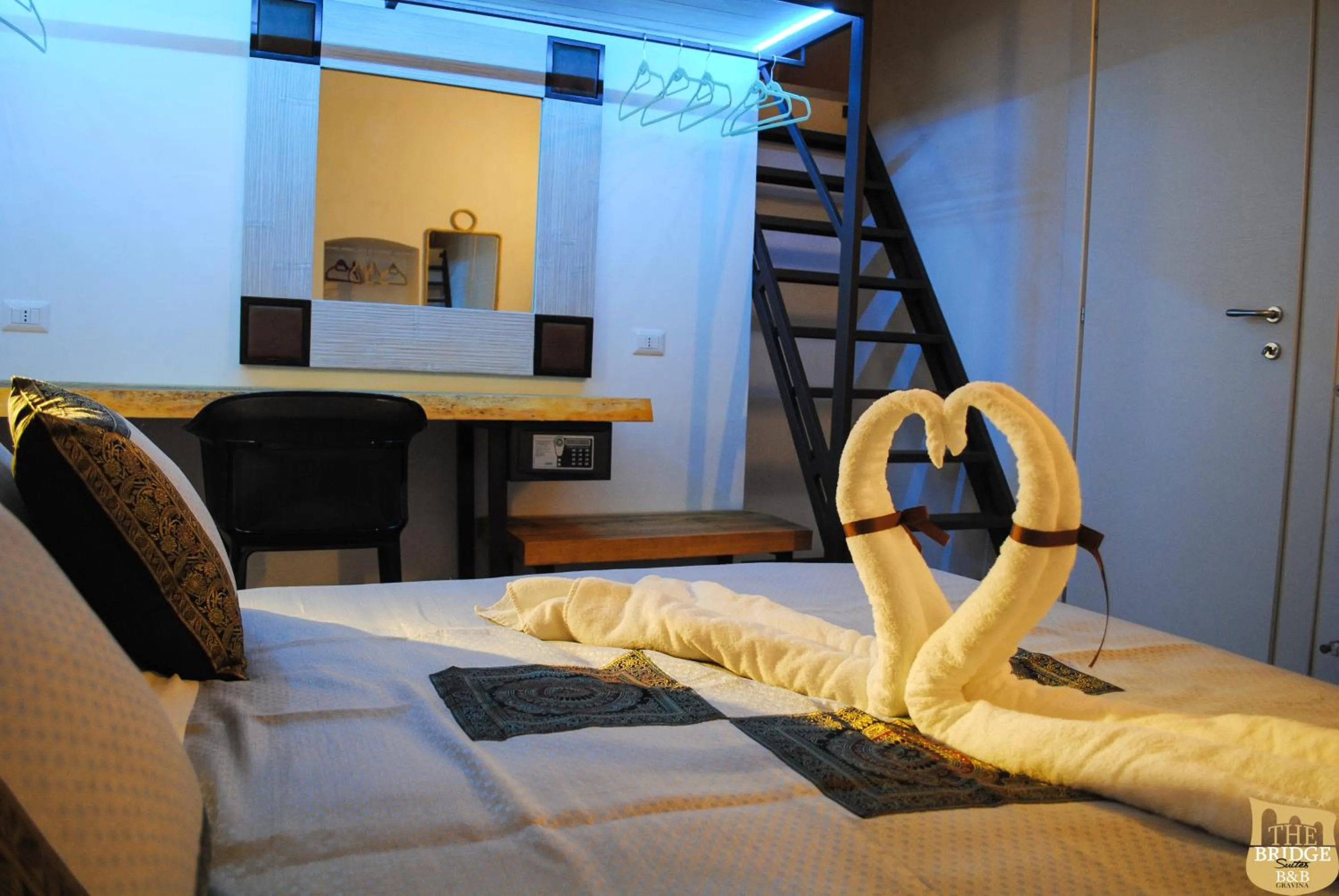 Bed in The Bridge Suites