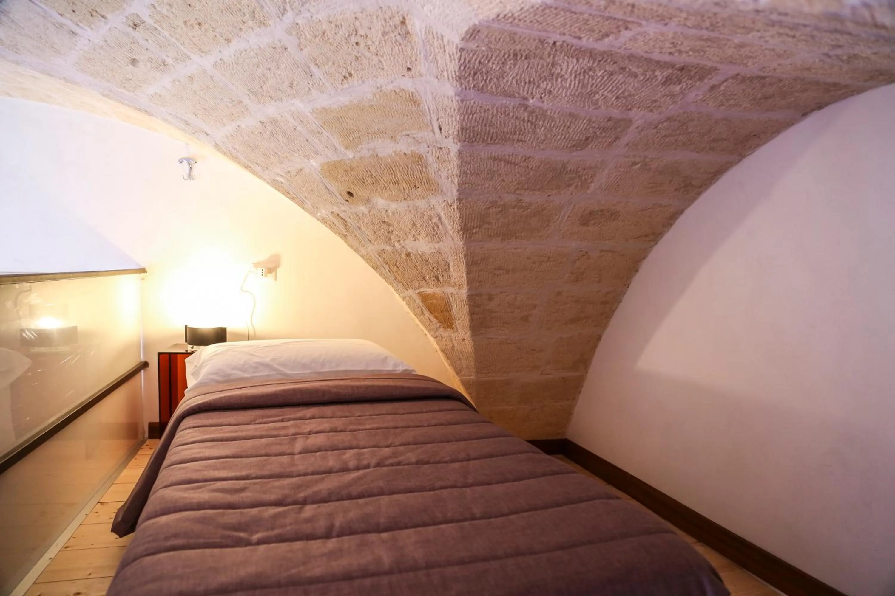 Bed in The Bridge Suites