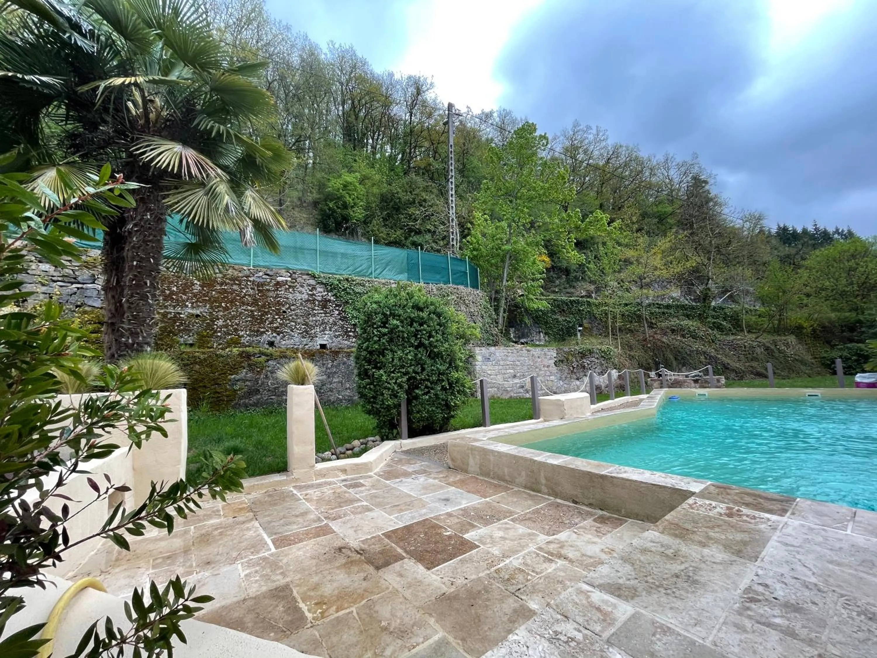 Swimming pool in Hôtel Le Moulin D'Olt