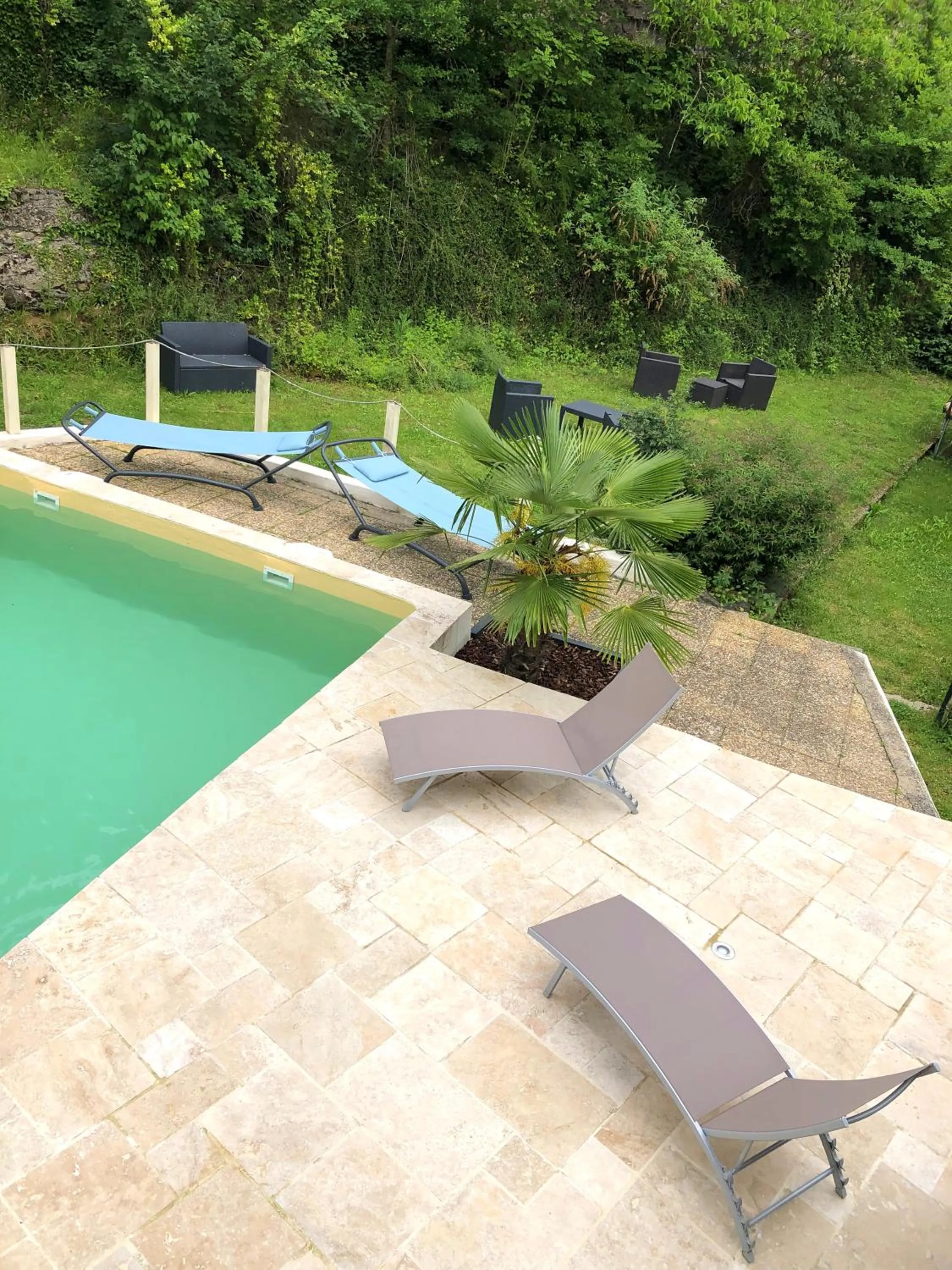 Garden view in Hôtel Le Moulin D'Olt