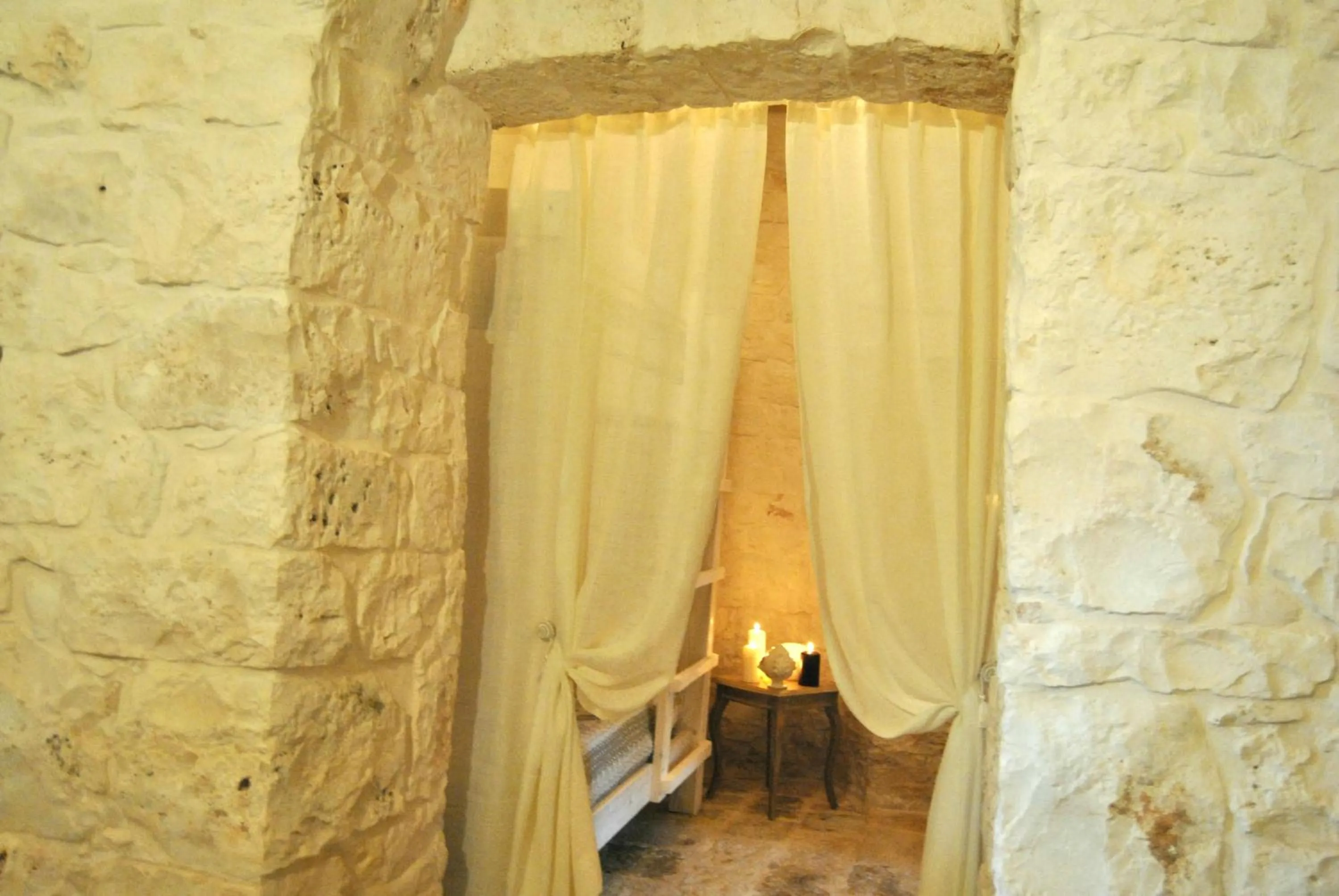 Bed in Trulli Sciummo Relais