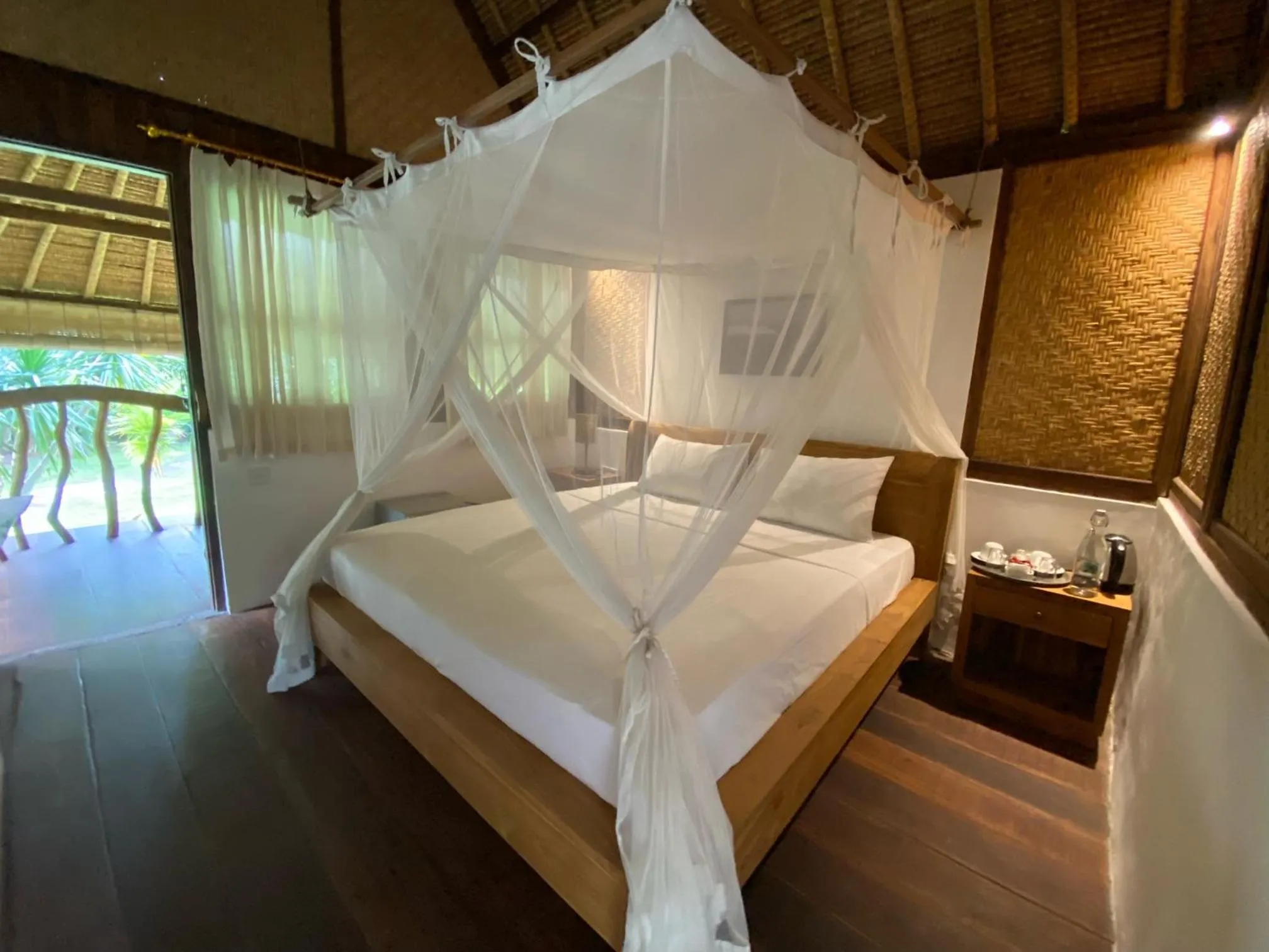 Bed in Flower Bud Bungalow Balangan