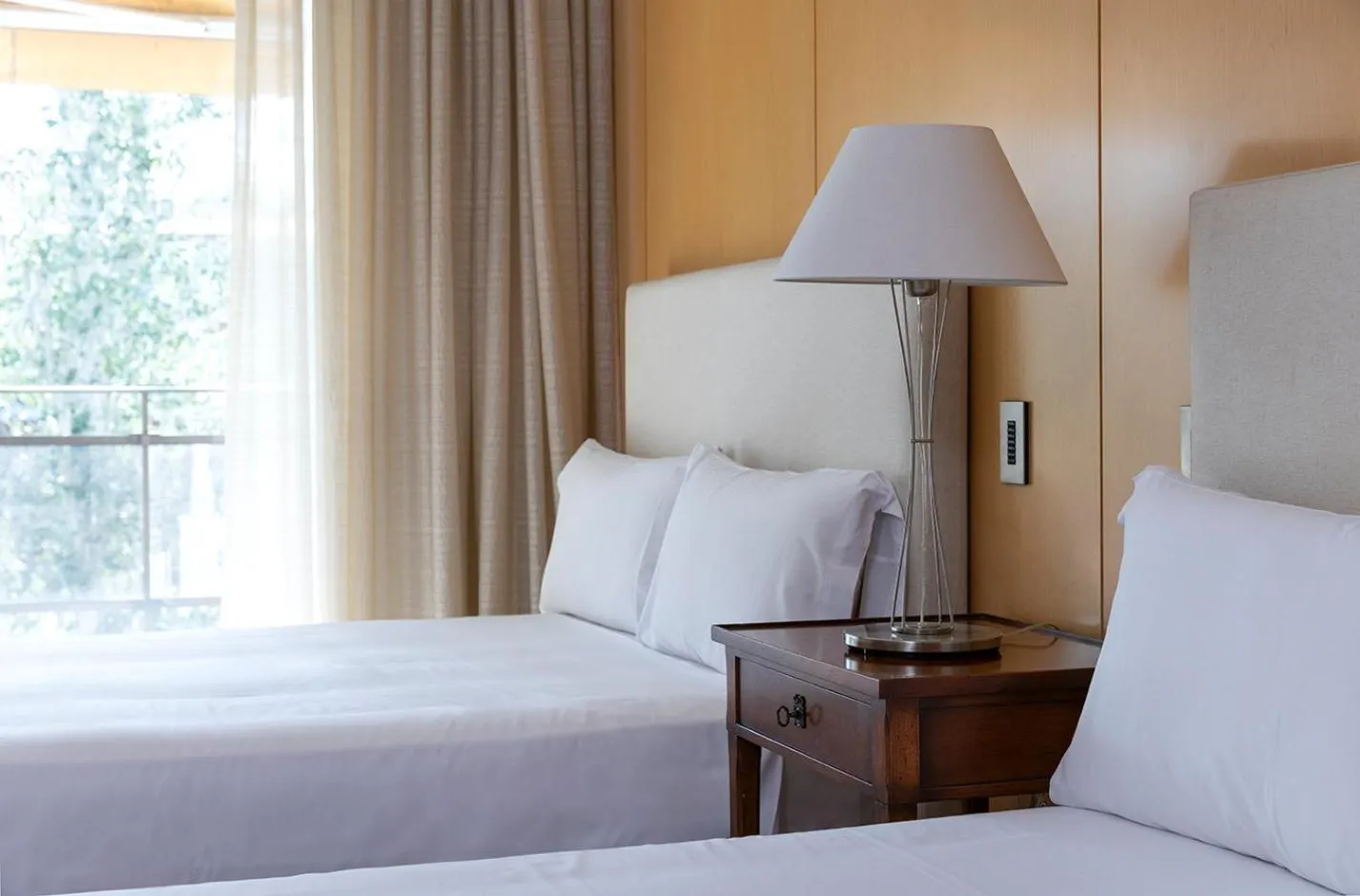 Bed in Suites del Mar Fenals Apartments