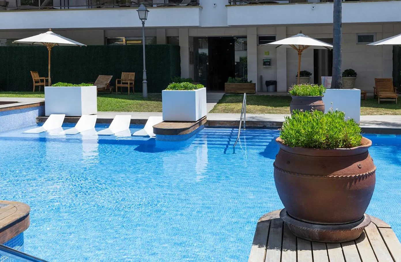 Swimming pool in Suites del Mar Fenals Apartments